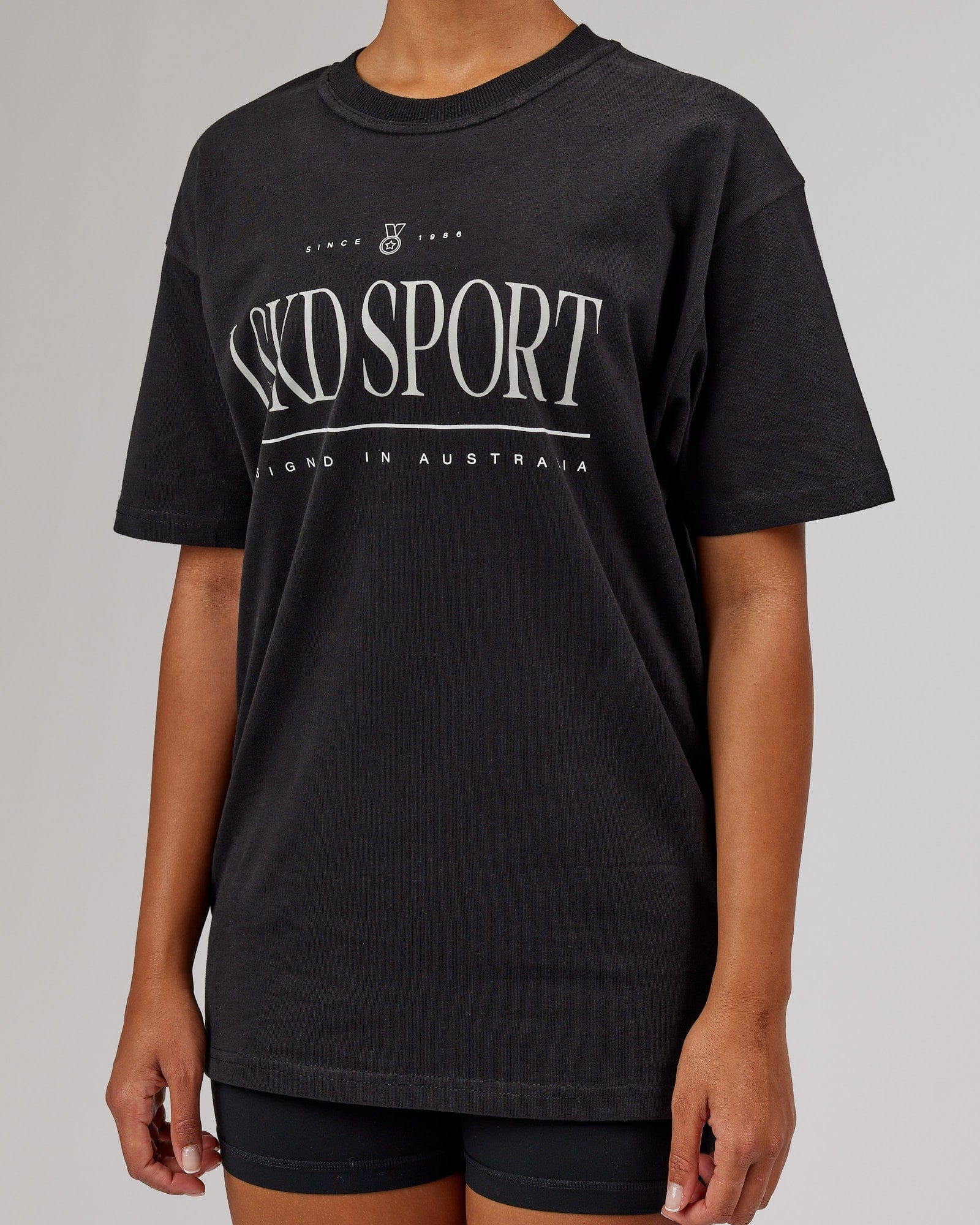 Model wearing Unisex Heritage Heavyweight Tee Oversize - Black-Beige