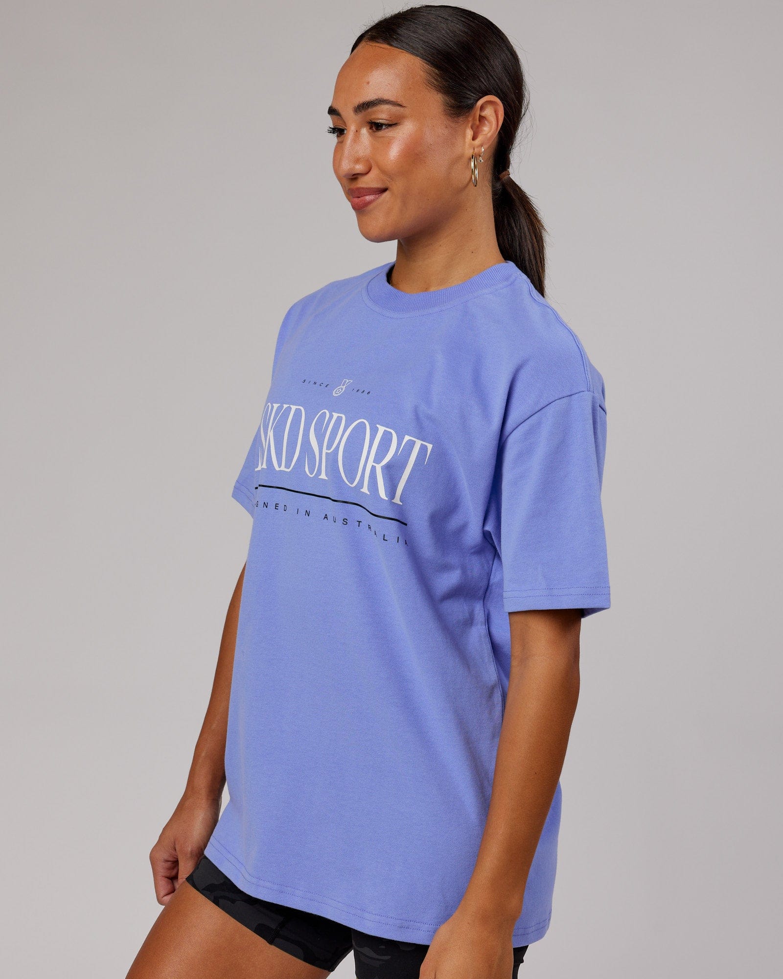 Model wearing Unisex Heritage Heavyweight Tee Oversize - Cornflower Blue