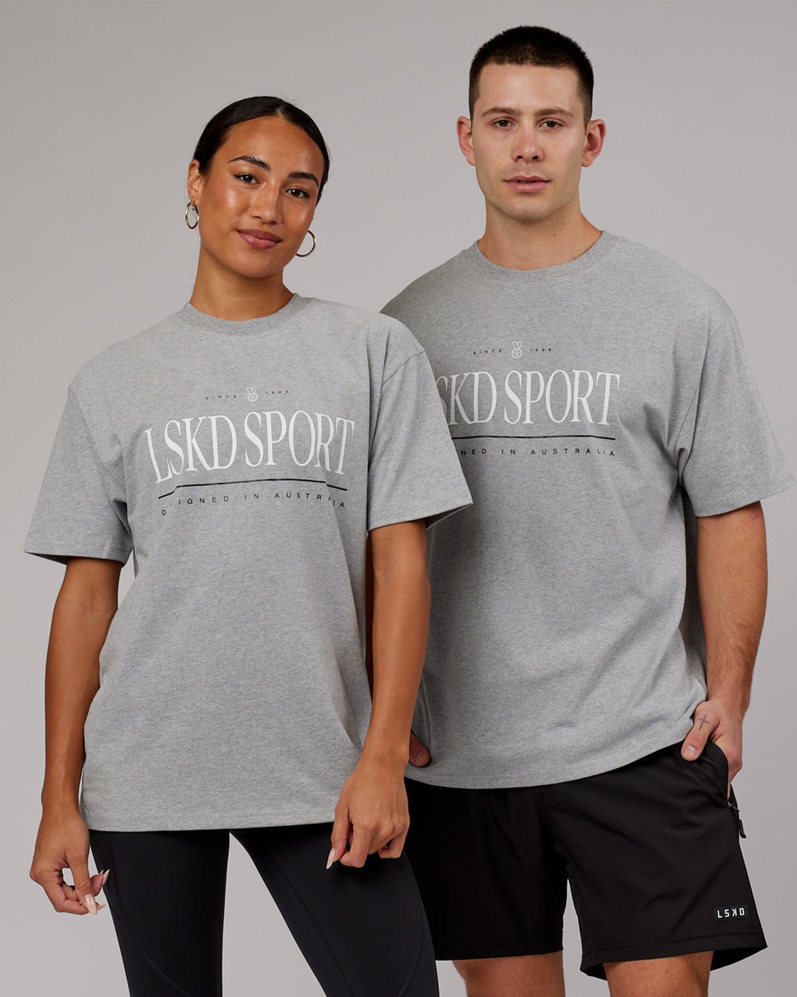 Model wearing Unisex Heritage Heavyweight Tee Oversize - Lt Grey Marl