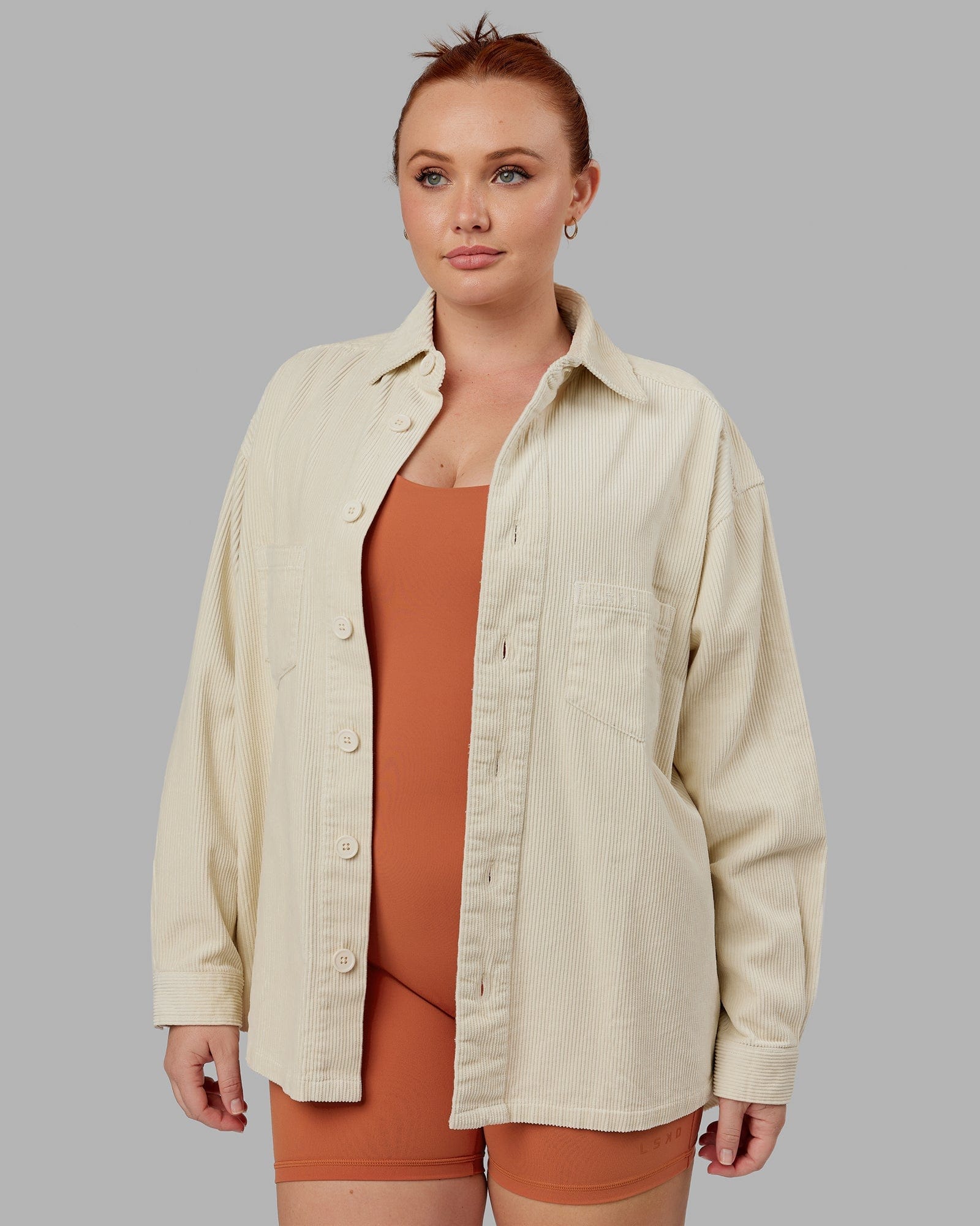 Model wearing Unisex Iconic Cord Shacket - Bone