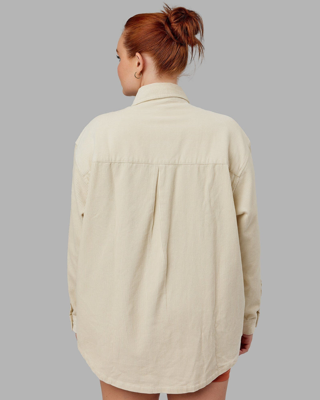 Model wearing Unisex Iconic Cord Shacket - Bone