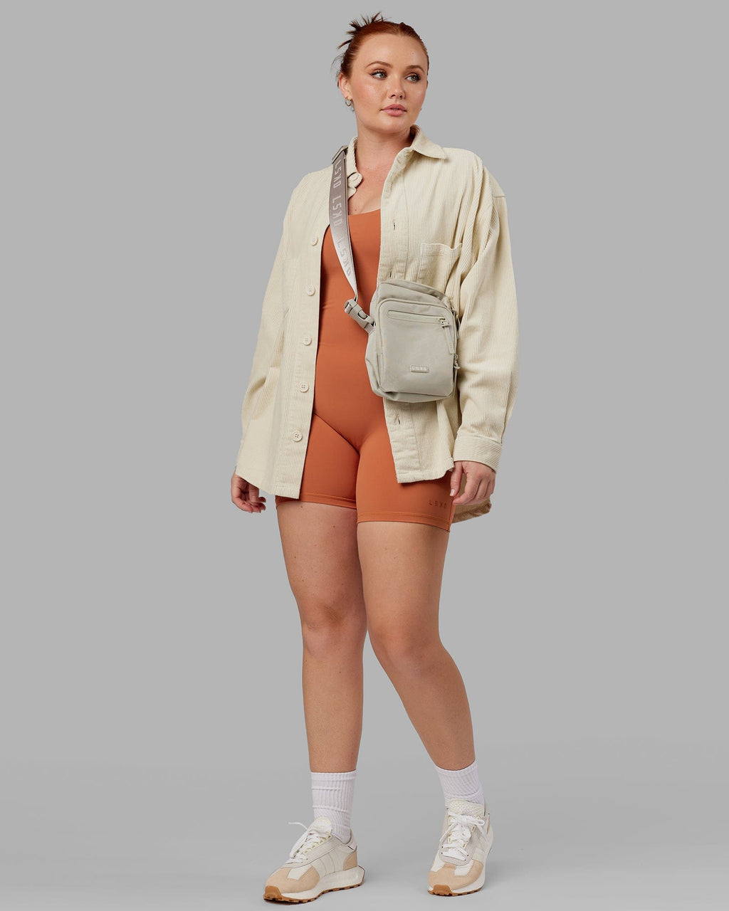 Model wearing Unisex Iconic Cord Shacket - Bone