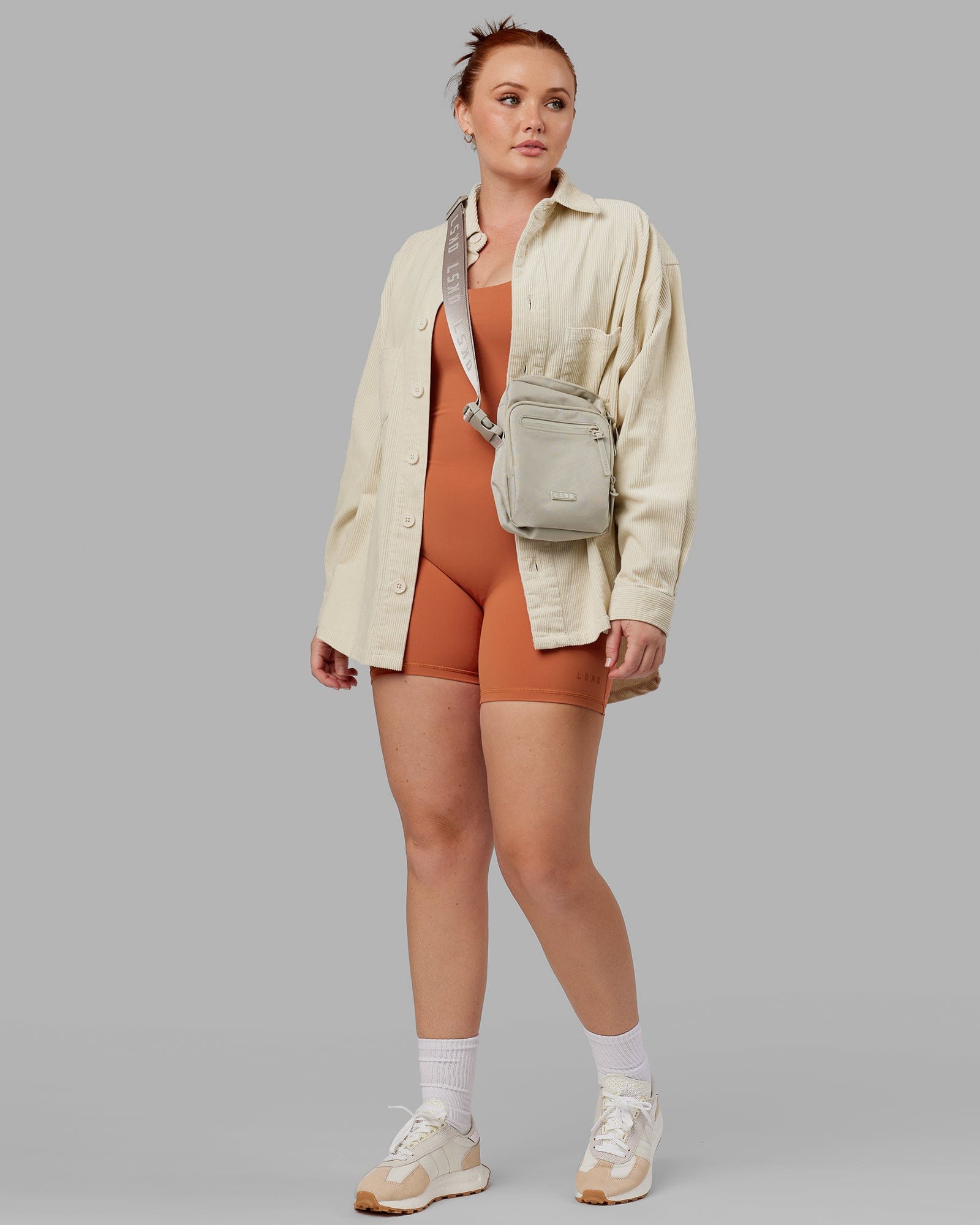 Model wearing Unisex Iconic Cord Shacket - Bone