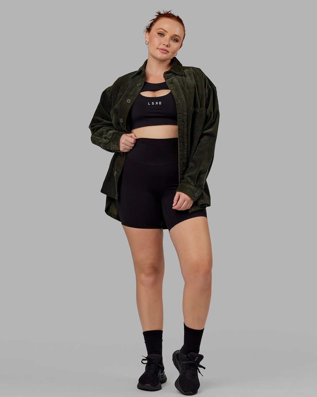 Model wearing Unisex Iconic Cord Shacket - Forest Night