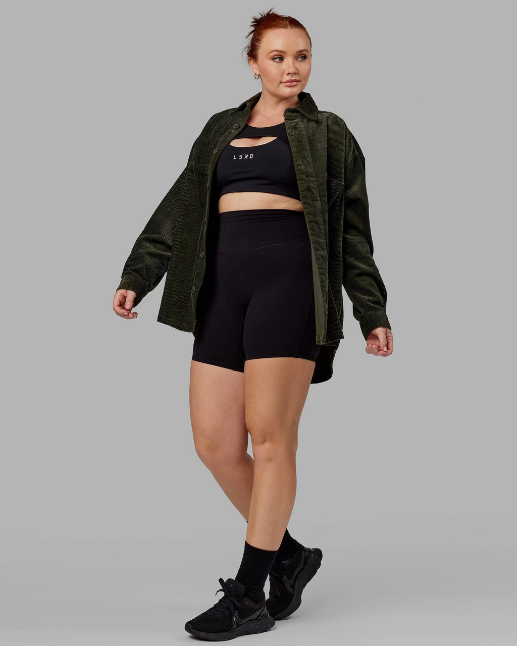 Model wearing Unisex Iconic Cord Shacket - Forest Night