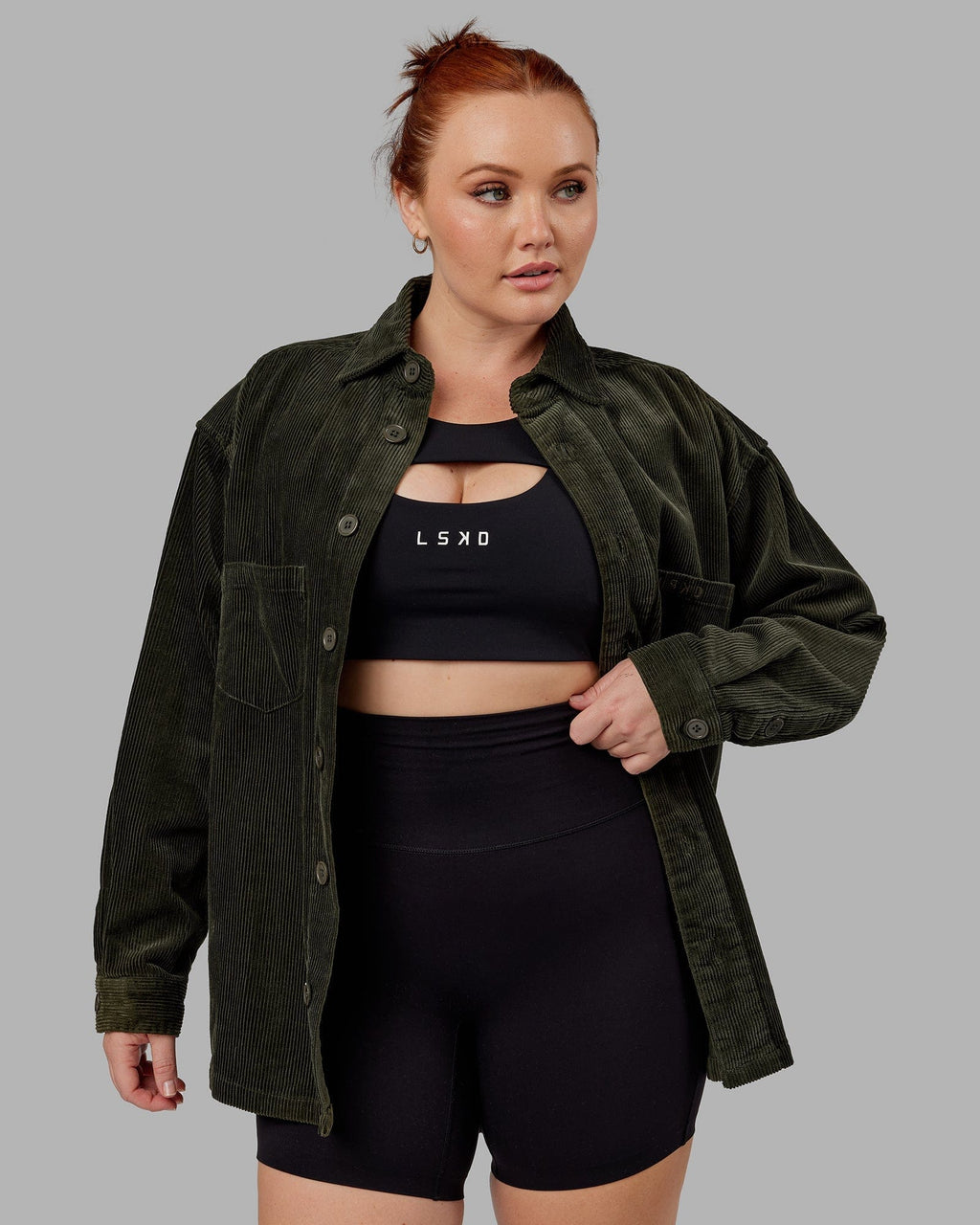 Model wearing Unisex Iconic Cord Shacket - Forest Night