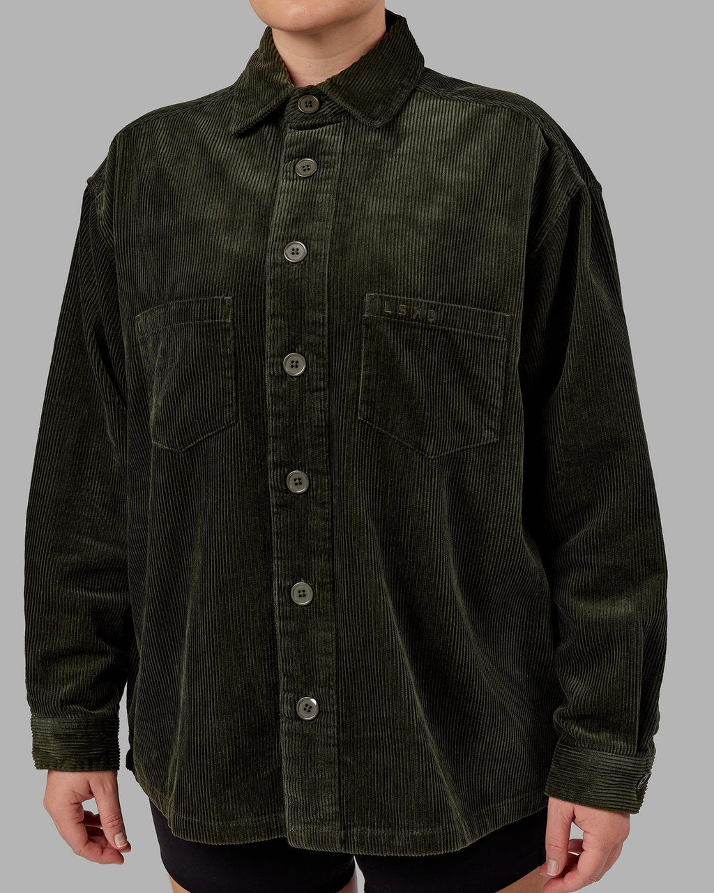 Model wearing Unisex Iconic Cord Shacket - Forest Night