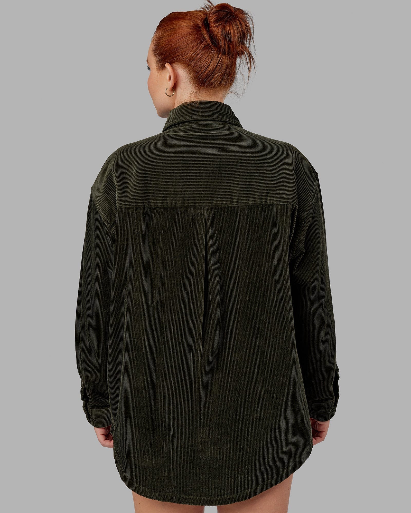 Model wearing Unisex Iconic Cord Shacket - Forest Night