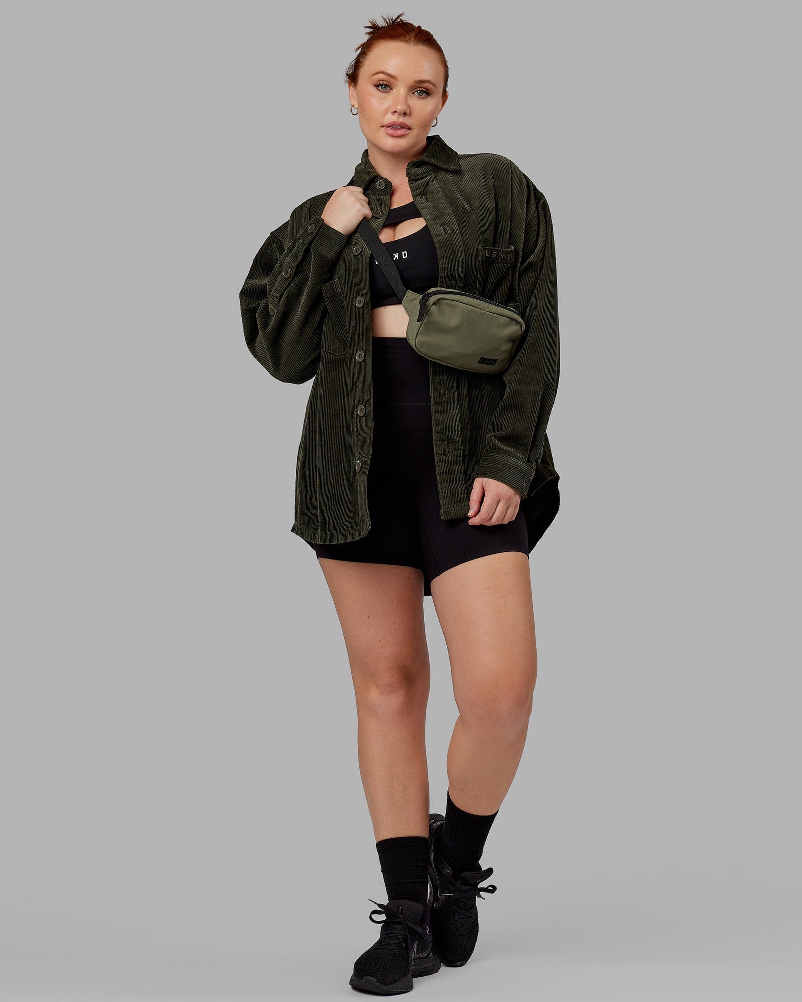 Model wearing Unisex Iconic Cord Shacket - Forest Night