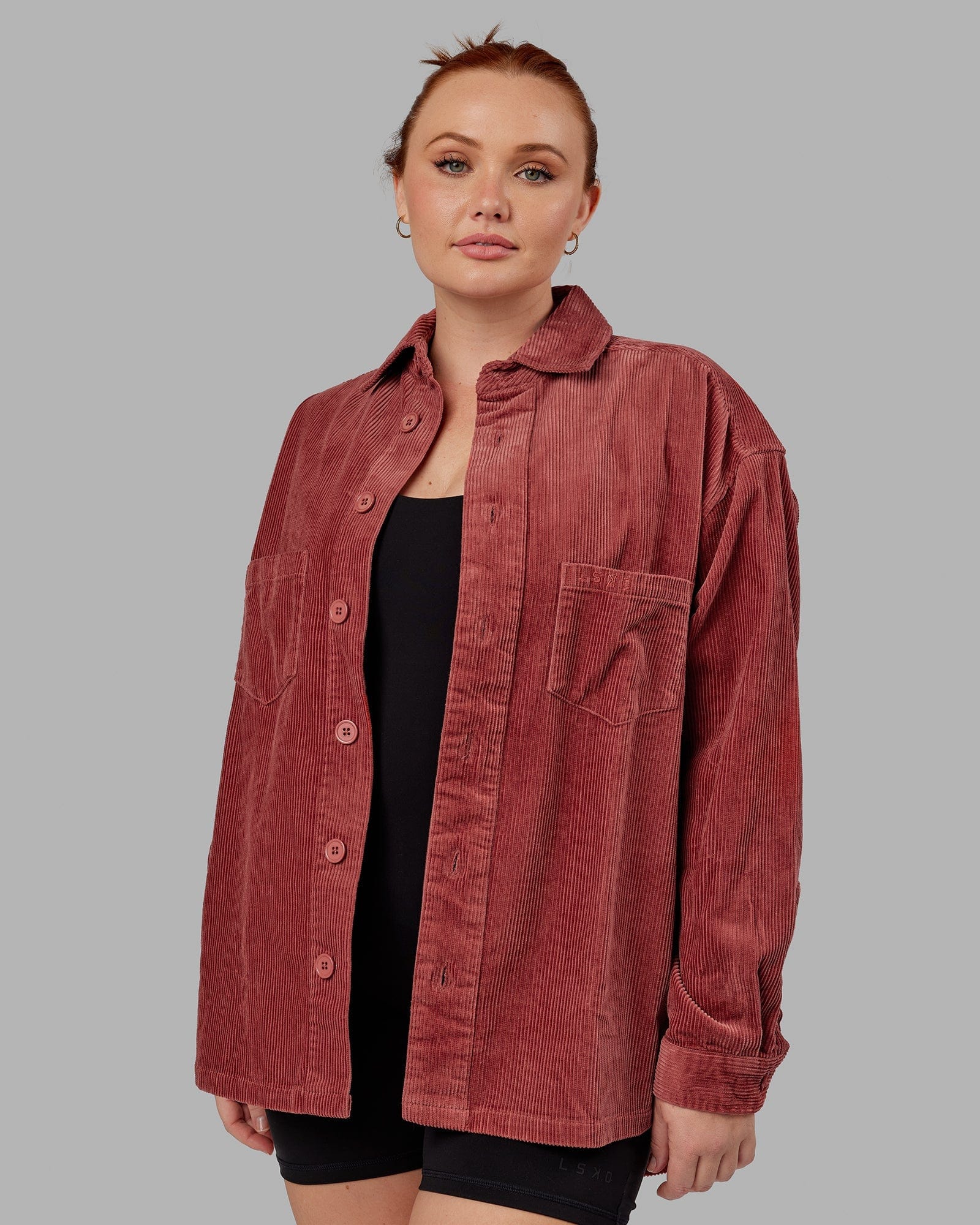 Model wearing Unisex Iconic Cord Shacket - Marsala