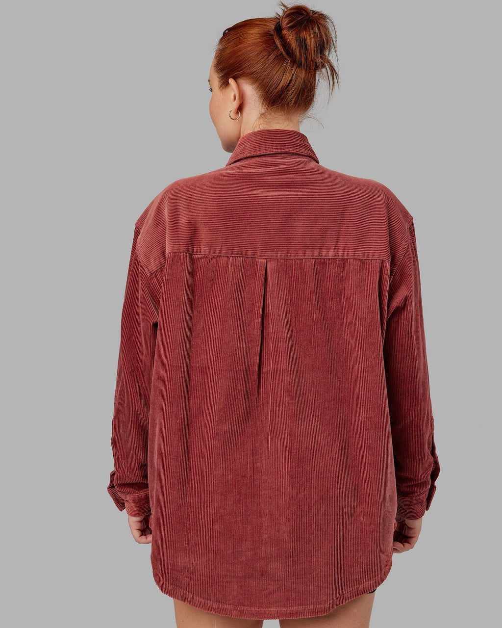 Model wearing Unisex Iconic Cord Shacket - Marsala