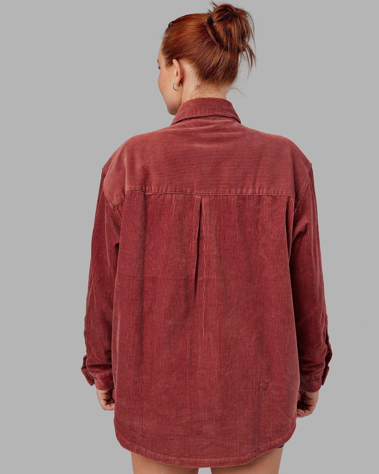 Model wearing Unisex Iconic Cord Shacket - Marsala