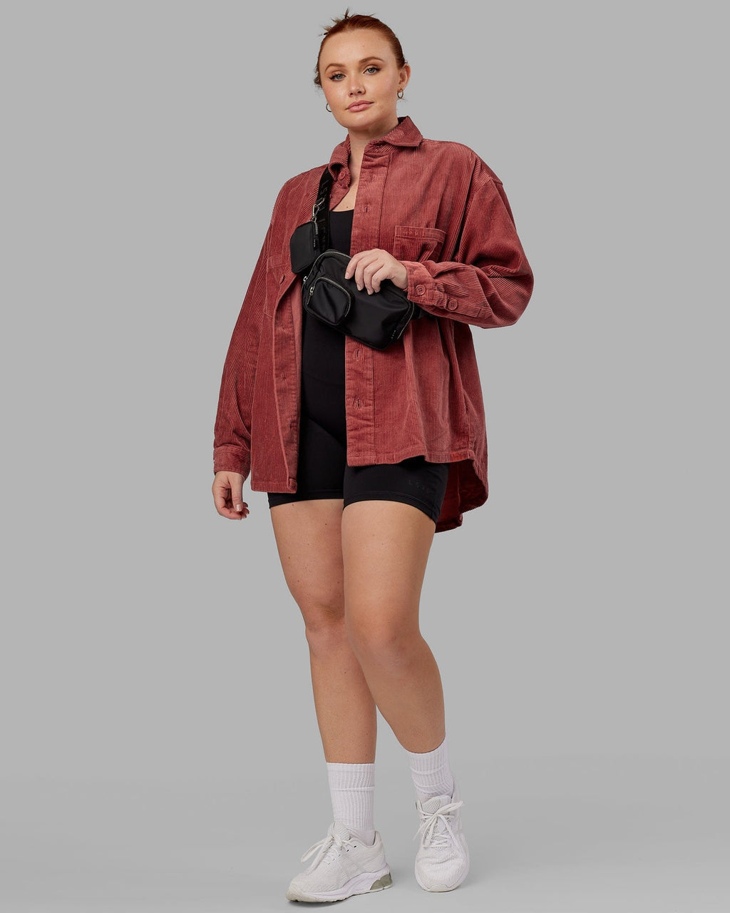 Model wearing Unisex Iconic Cord Shacket - Marsala