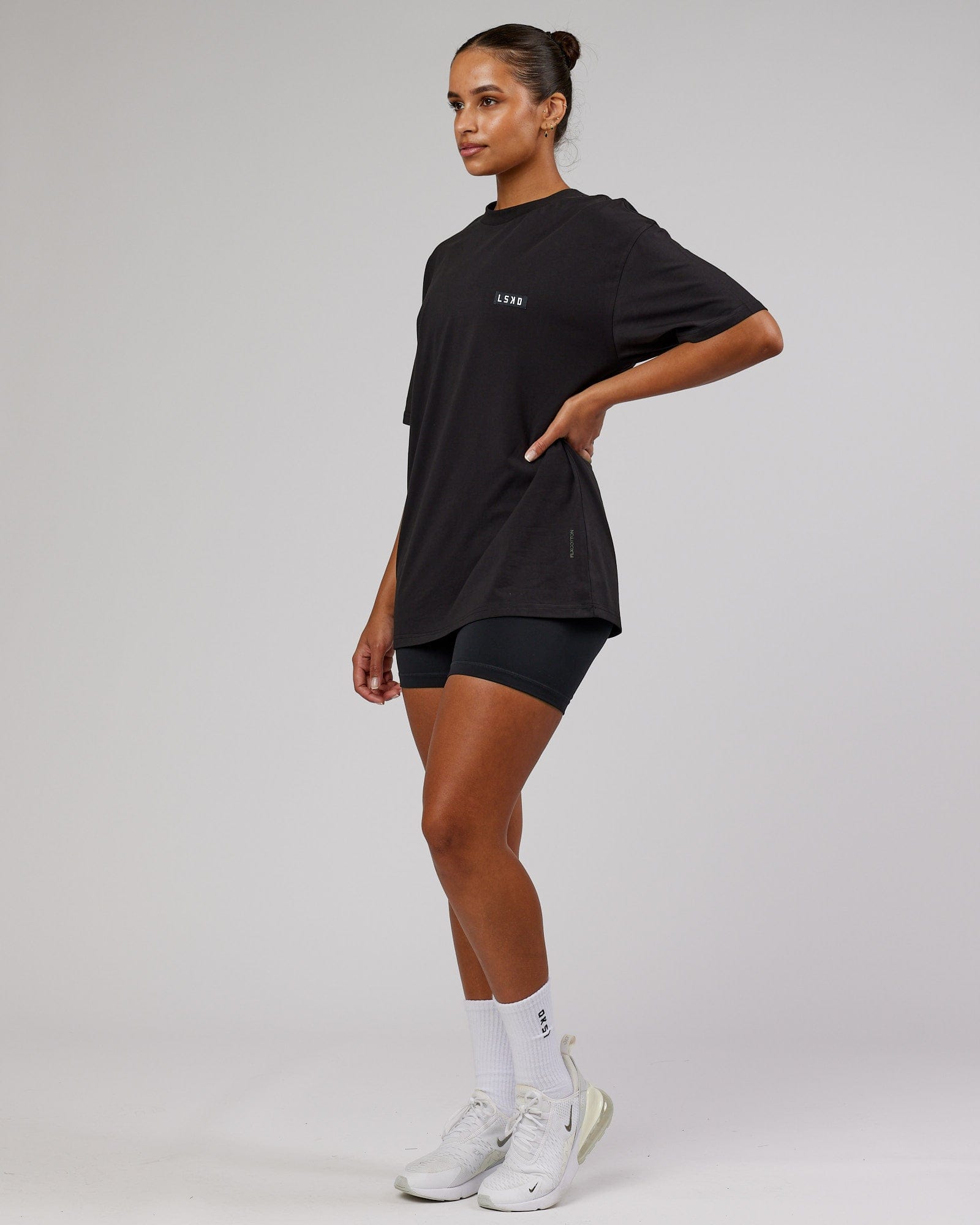 Model wearing Unisex Iconic FLXCotton Tee Oversize - Black-White