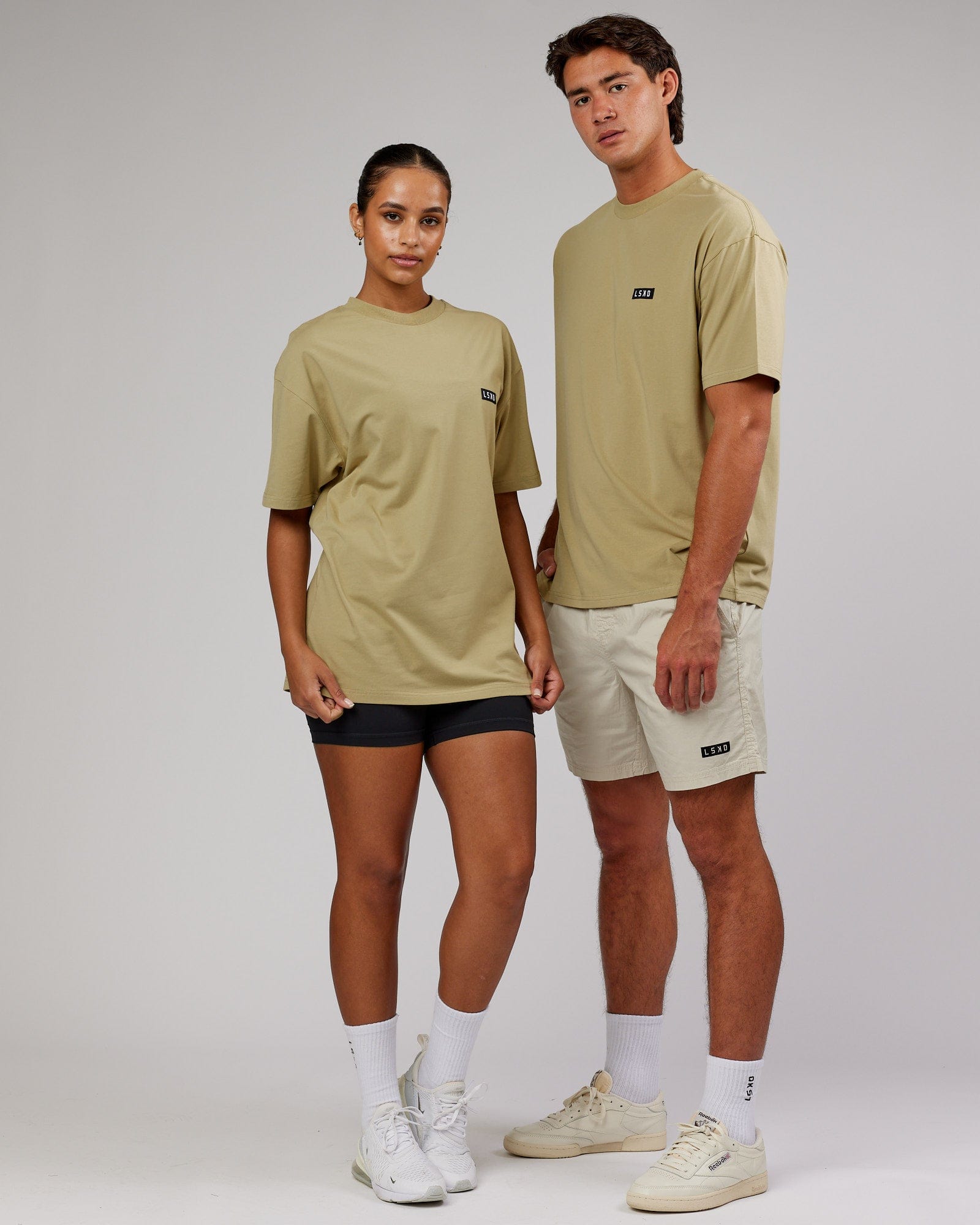 Model wearing Unisex Iconic FLXCotton Tee Oversize - Reed