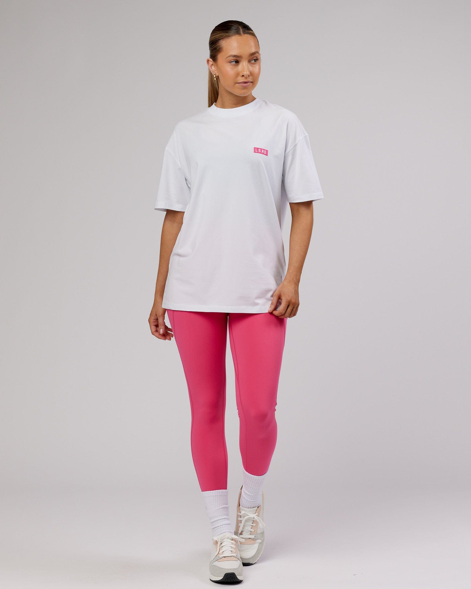 Model wearing Unisex Iconic FLXCotton Tee Oversize - White-Pink