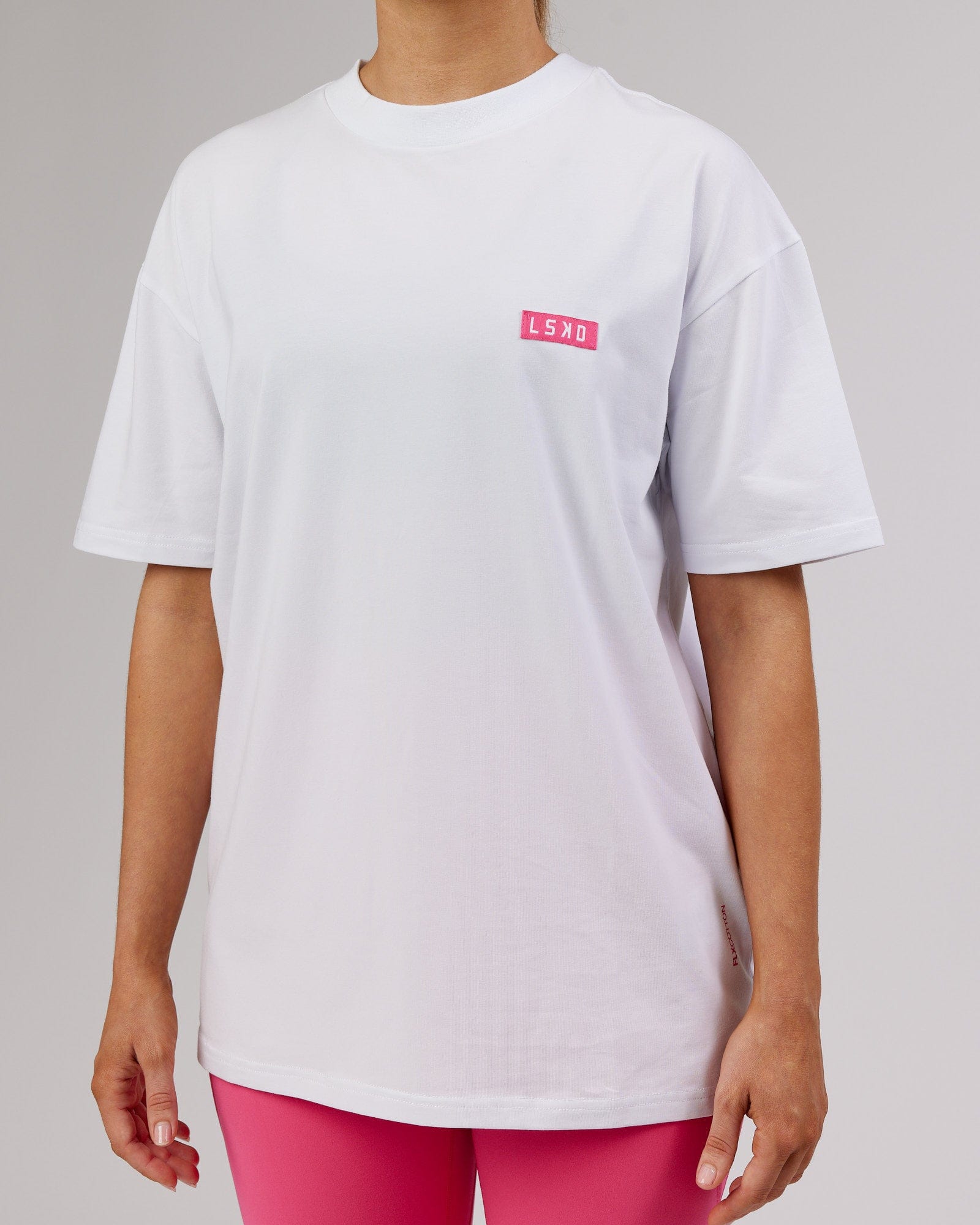 Model wearing Unisex Iconic FLXCotton Tee Oversize - White-Pink