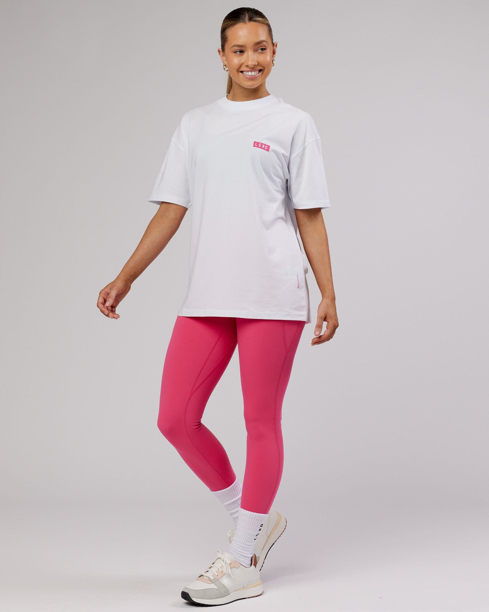 Model wearing Unisex Iconic FLXCotton Tee Oversize - White-Pink