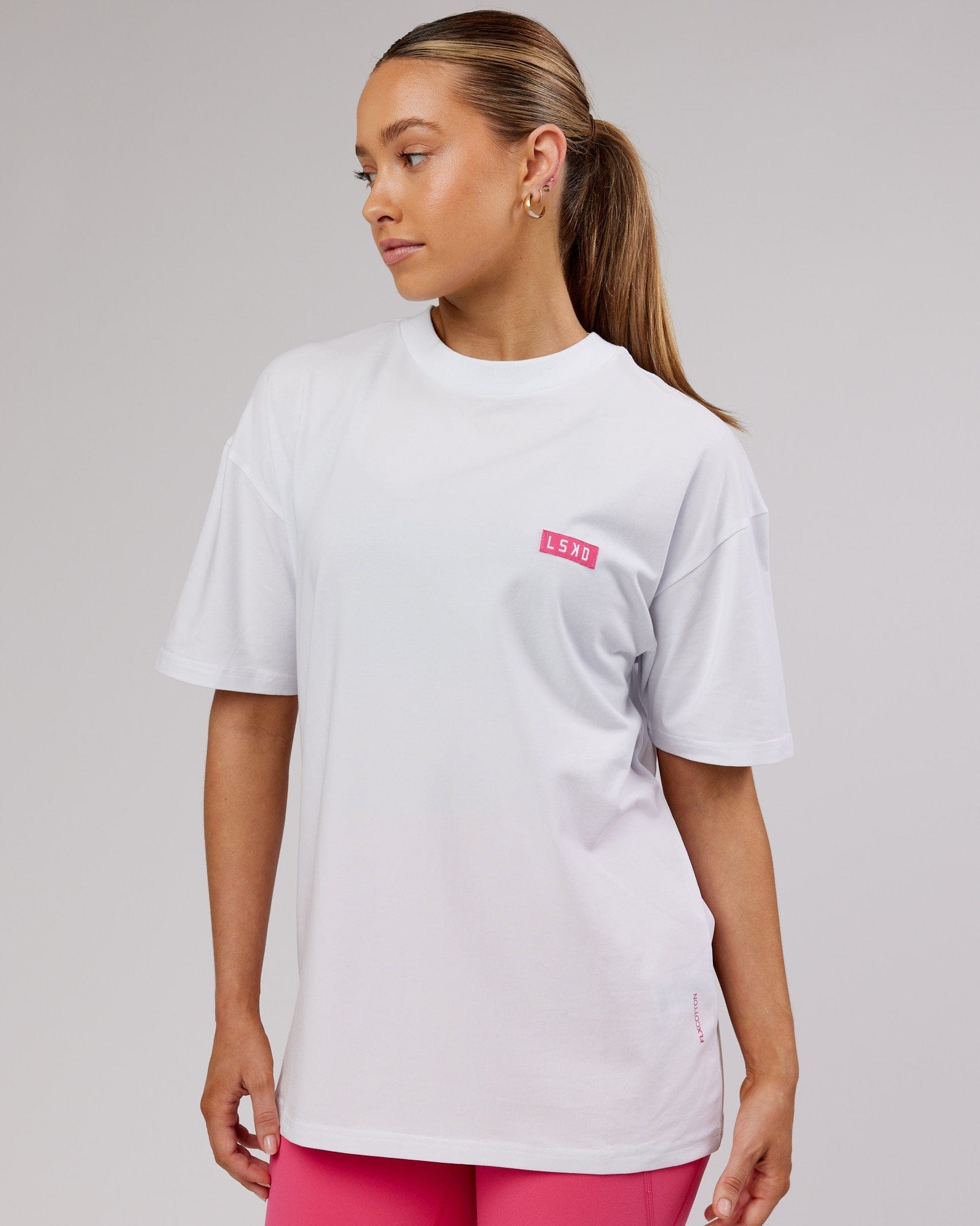 Model wearing Unisex Iconic FLXCotton Tee Oversize - White-Pink