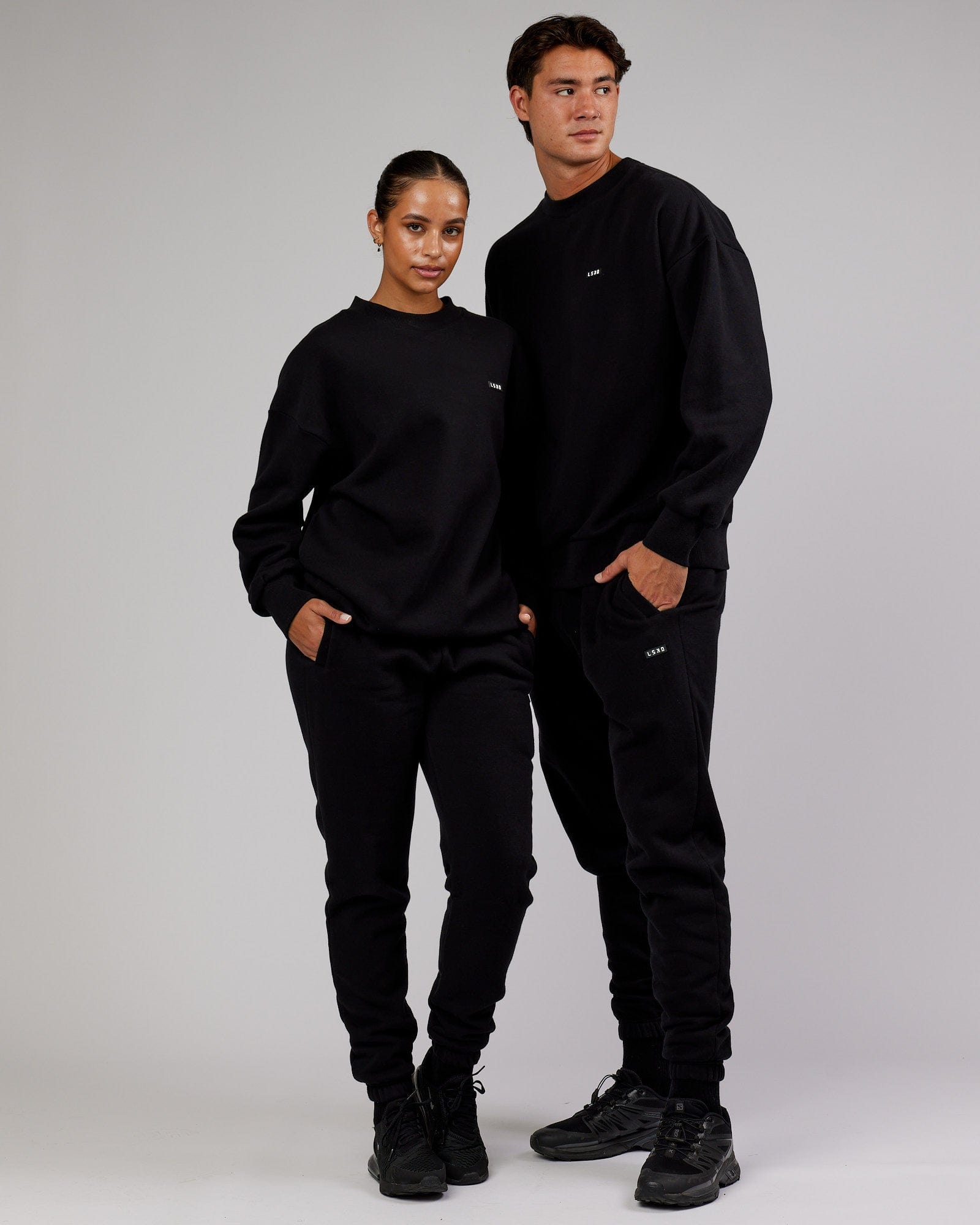 Model wearing Unisex Iconic Track Pant - Black