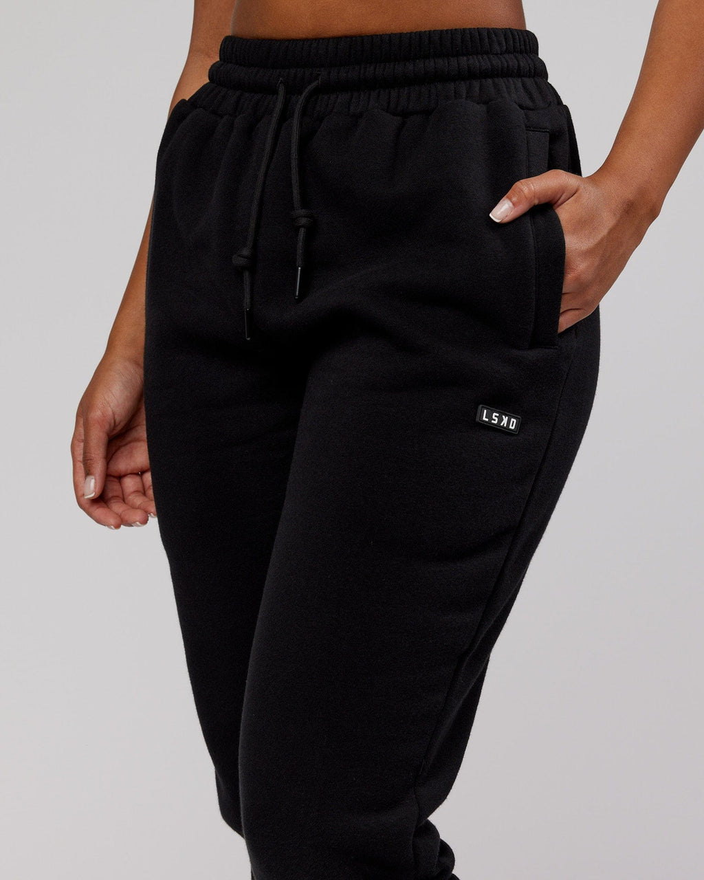 Model wearing Unisex Iconic Track Pant - Black