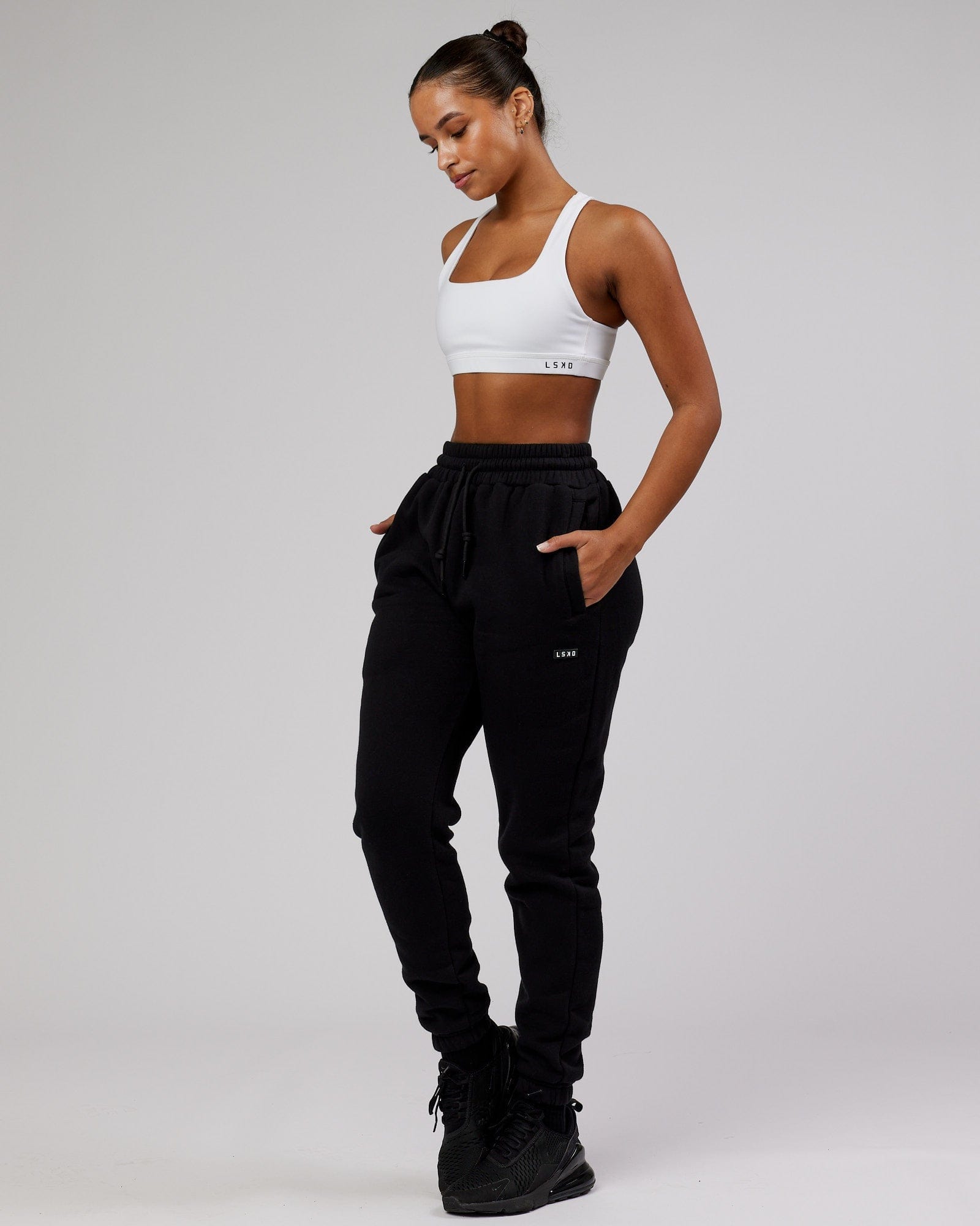Model wearing Unisex Iconic Track Pant - Black