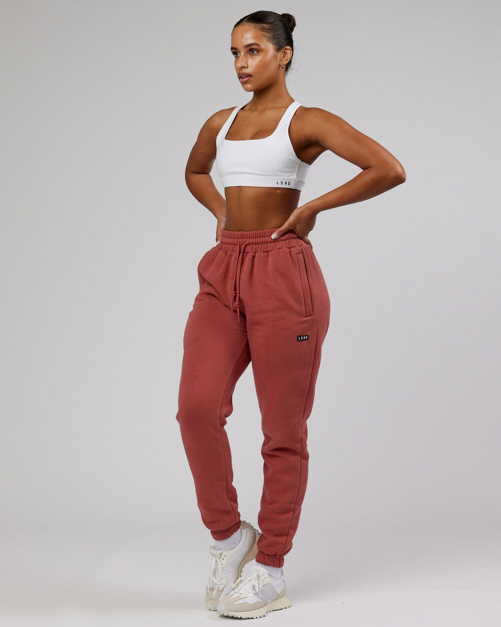 Model wearing Unisex Iconic Track Pant - Marsala