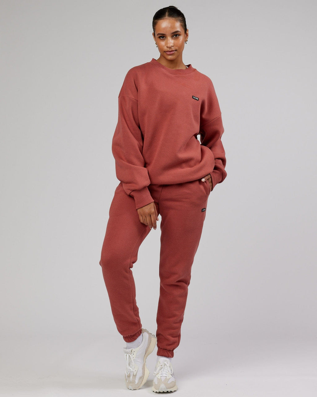 Model wearing Unisex Iconic Track Pant - Marsala