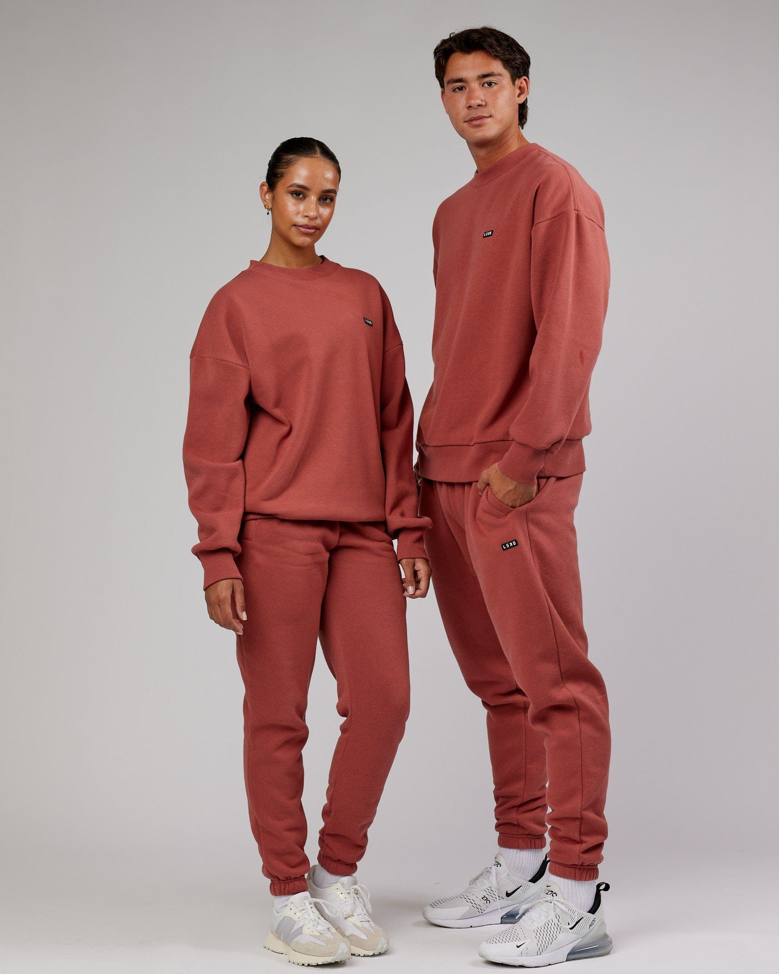 Model wearing Unisex Iconic Track Pant - Marsala