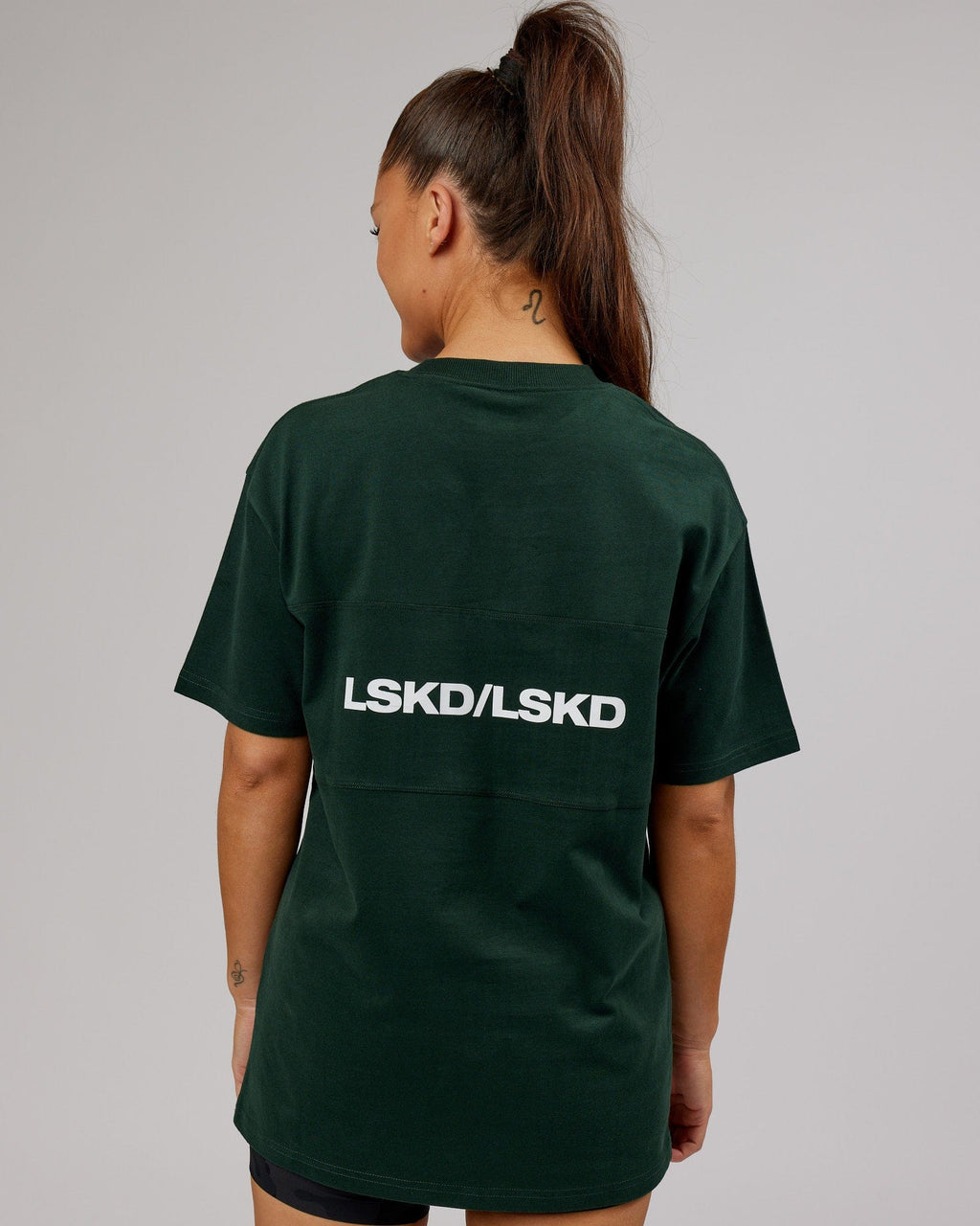 Model wearing Unisex Impact Heavyweight Tee Oversize - Forest