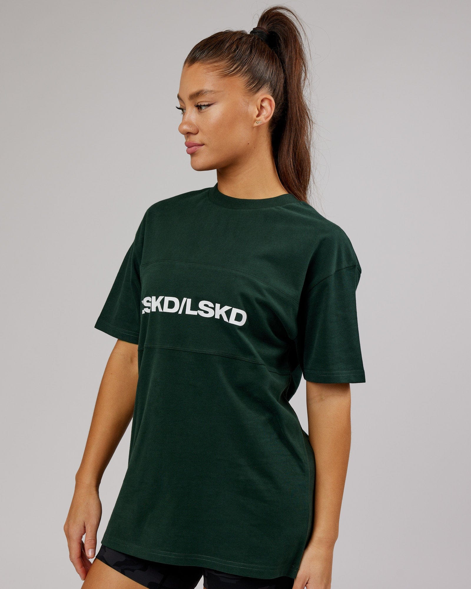 Model wearing Unisex Impact Heavyweight Tee Oversize - Forest