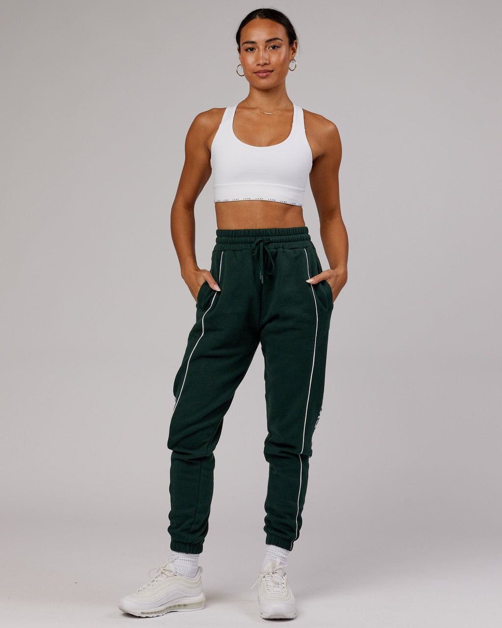 Model wearing Unisex Impact Trackpants - Forest