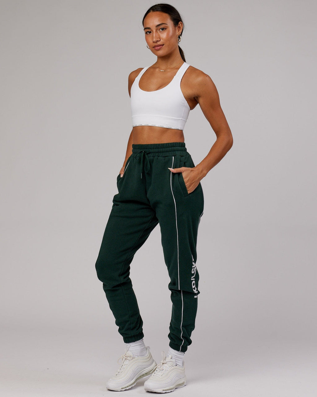 Model wearing Unisex Impact Trackpants - Forest