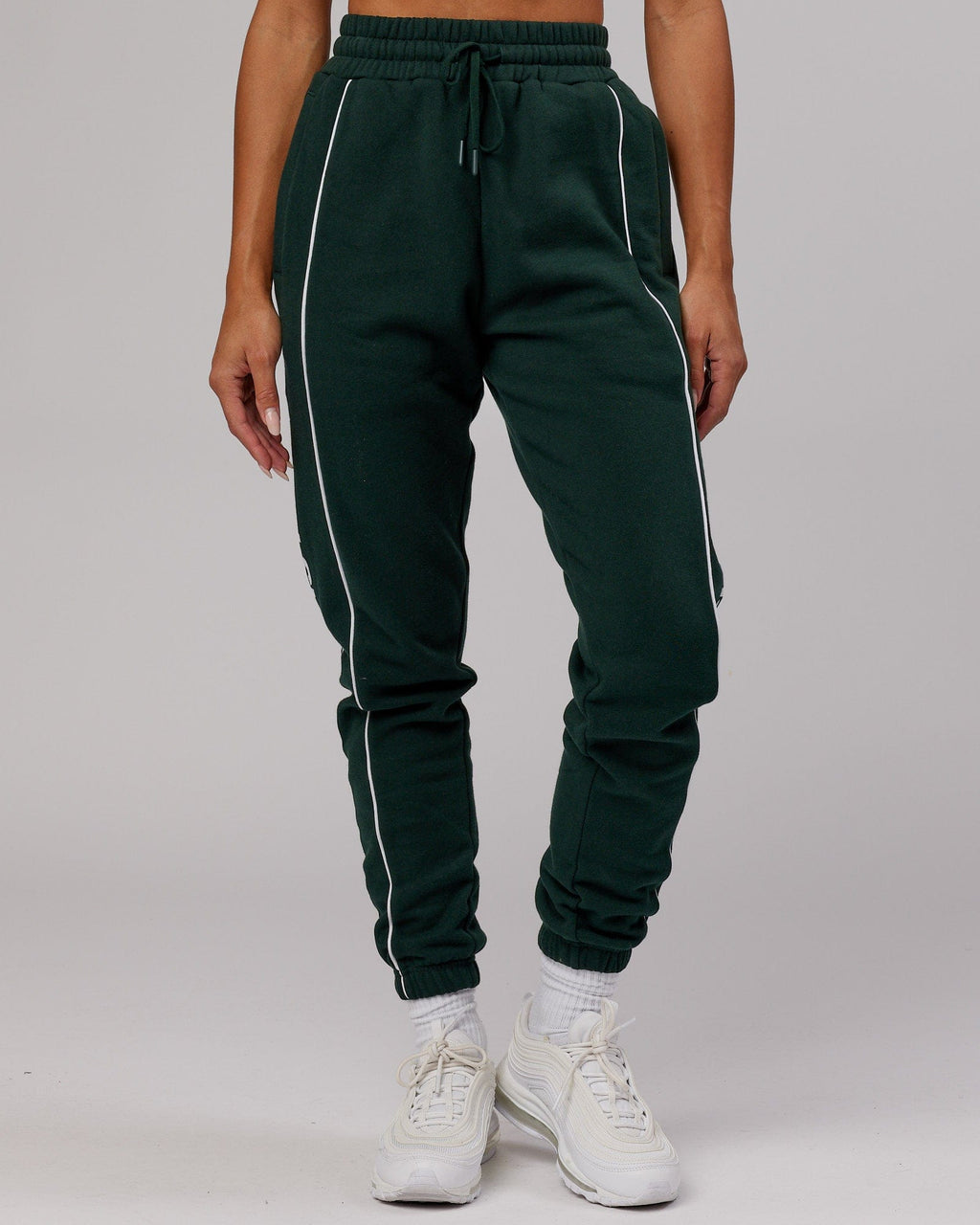 Model wearing Unisex Impact Trackpants - Forest