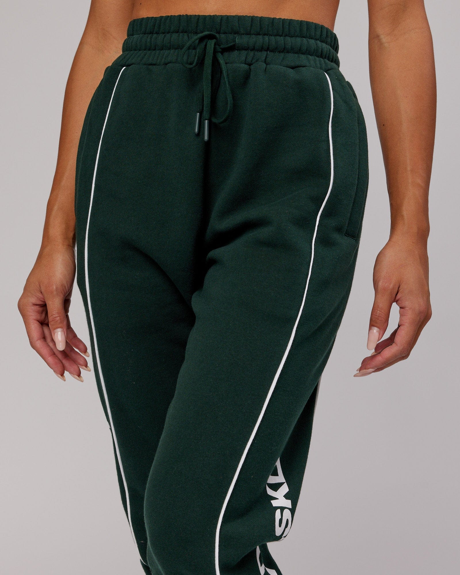 Model wearing Unisex Impact Trackpants - Forest