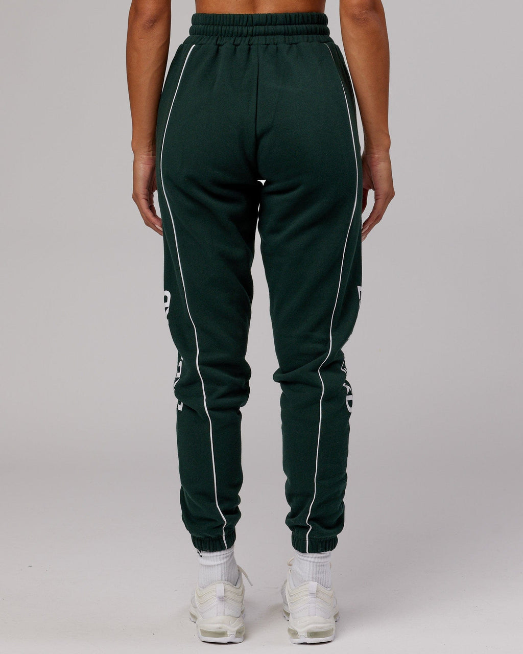 Model wearing Unisex Impact Trackpants - Forest