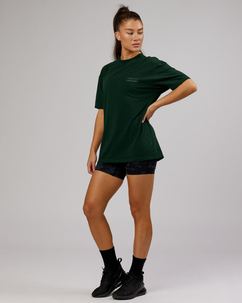 Model wearing Unisex Quad FLXCotton Tee Oversize - Forest