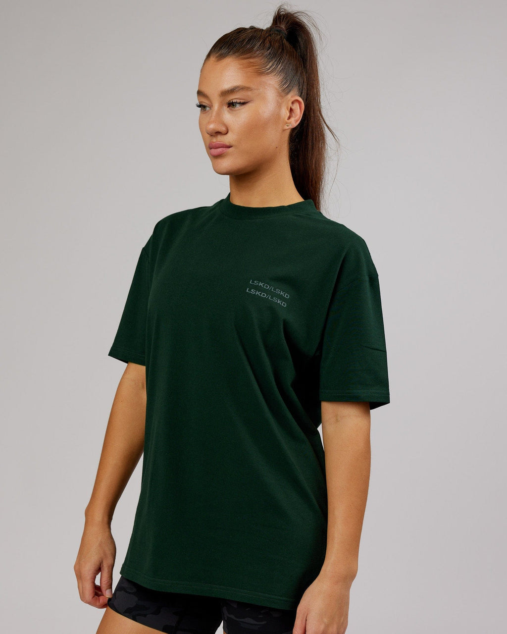 Model wearing Unisex Quad FLXCotton Tee Oversize - Forest