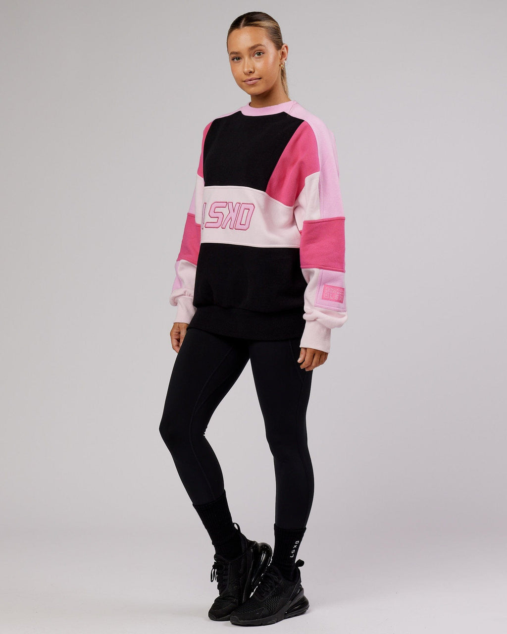 Model wearing Unisex Slam Sweater Oversize - Black-Pink Multi
