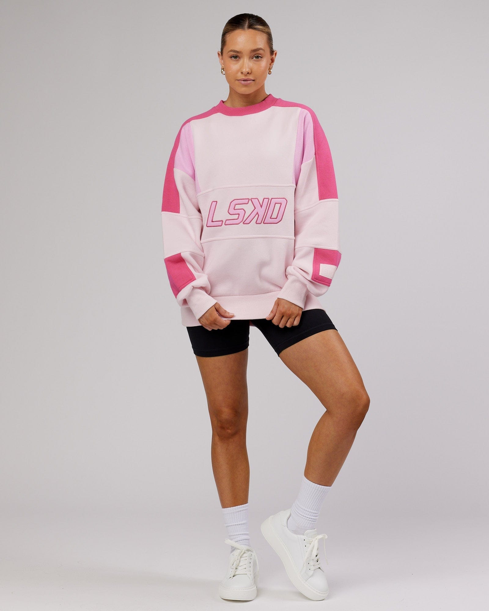Model wearing Unisex Slam Sweater Oversize - Pink Multi
