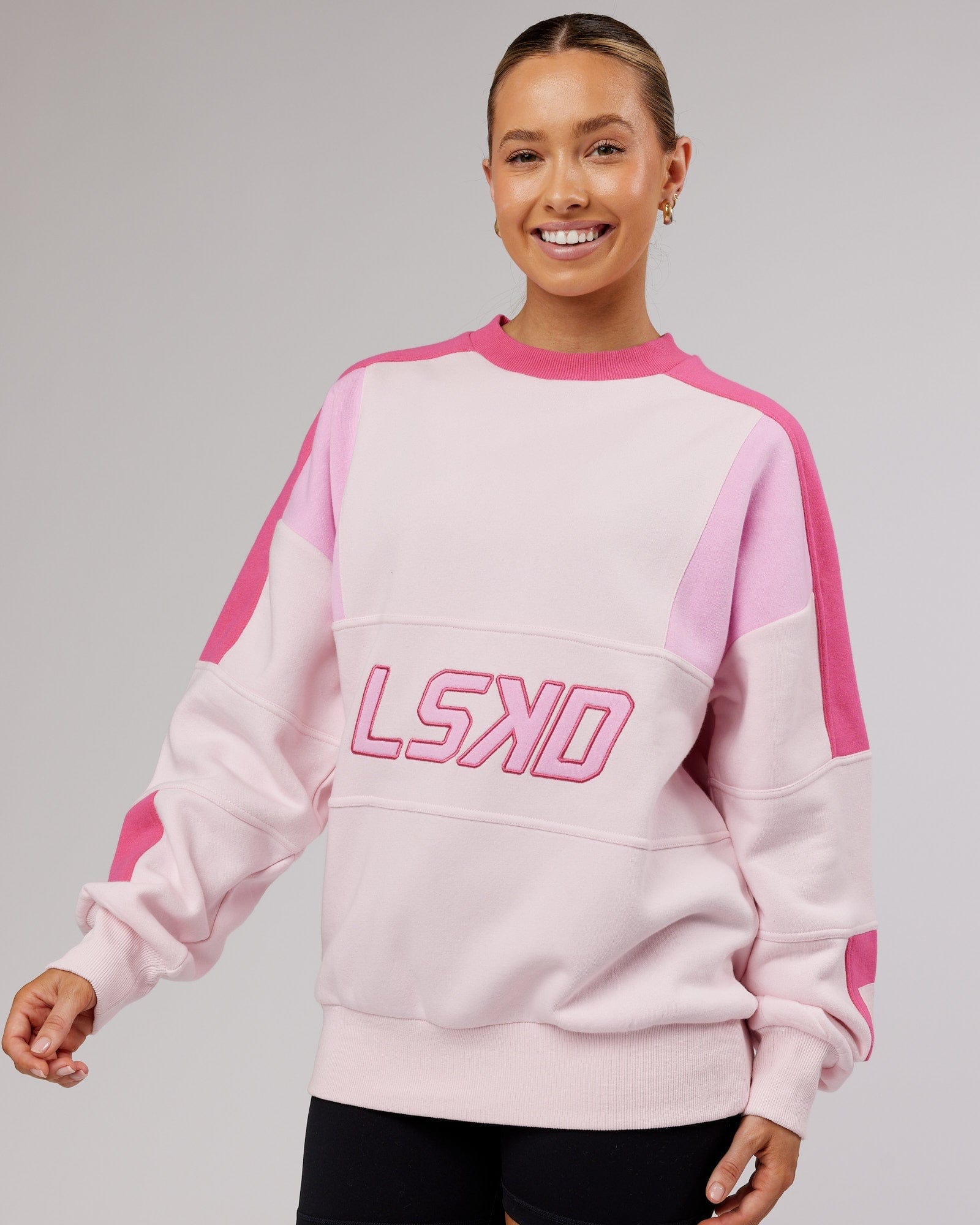 Model wearing Unisex Slam Sweater Oversize - Pink Multi