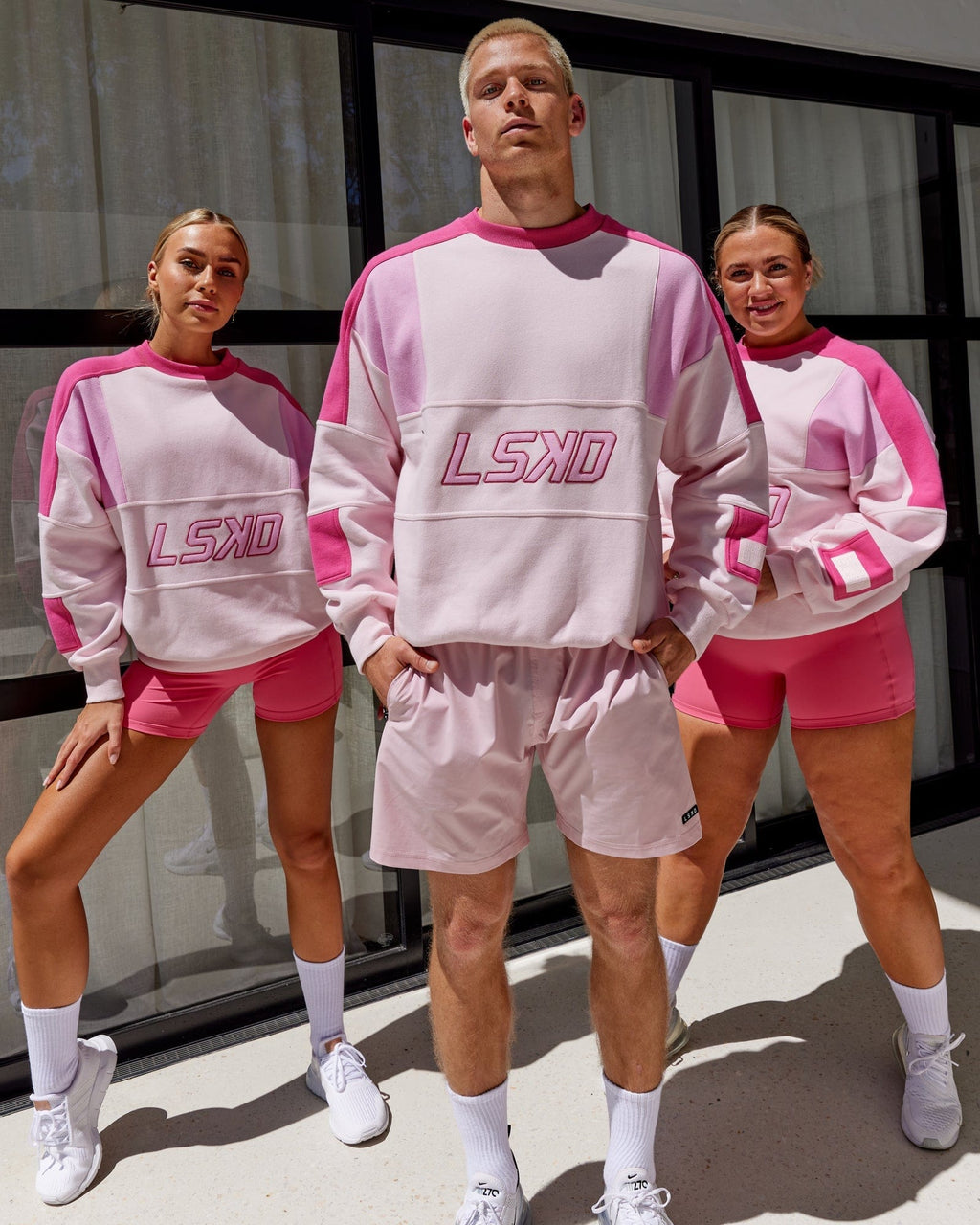 Model wearing Unisex Slam Sweater Oversize - Pink Multi