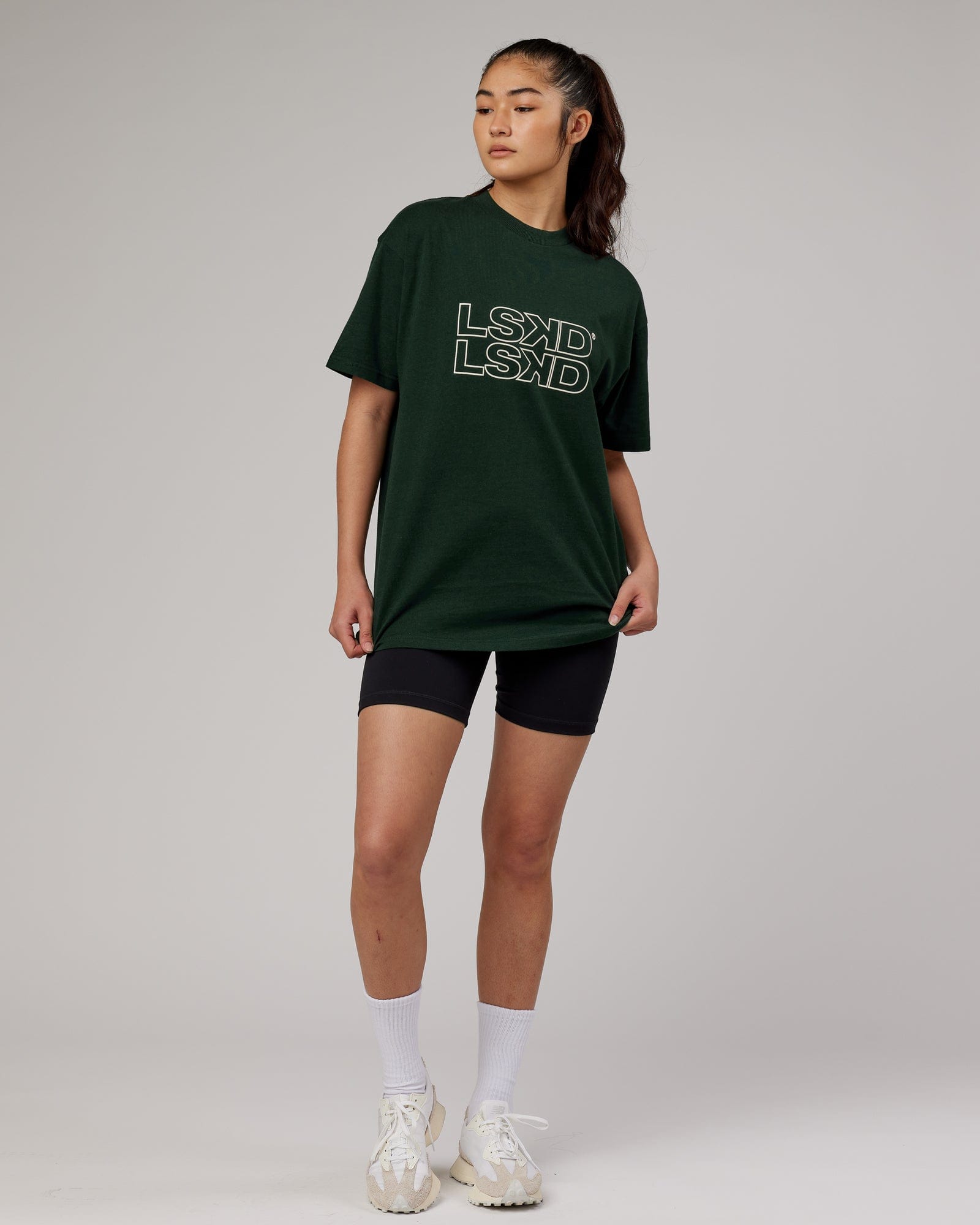 Model wearing Unisex Stacks Up Heavyweight Oversize Tee - Forest