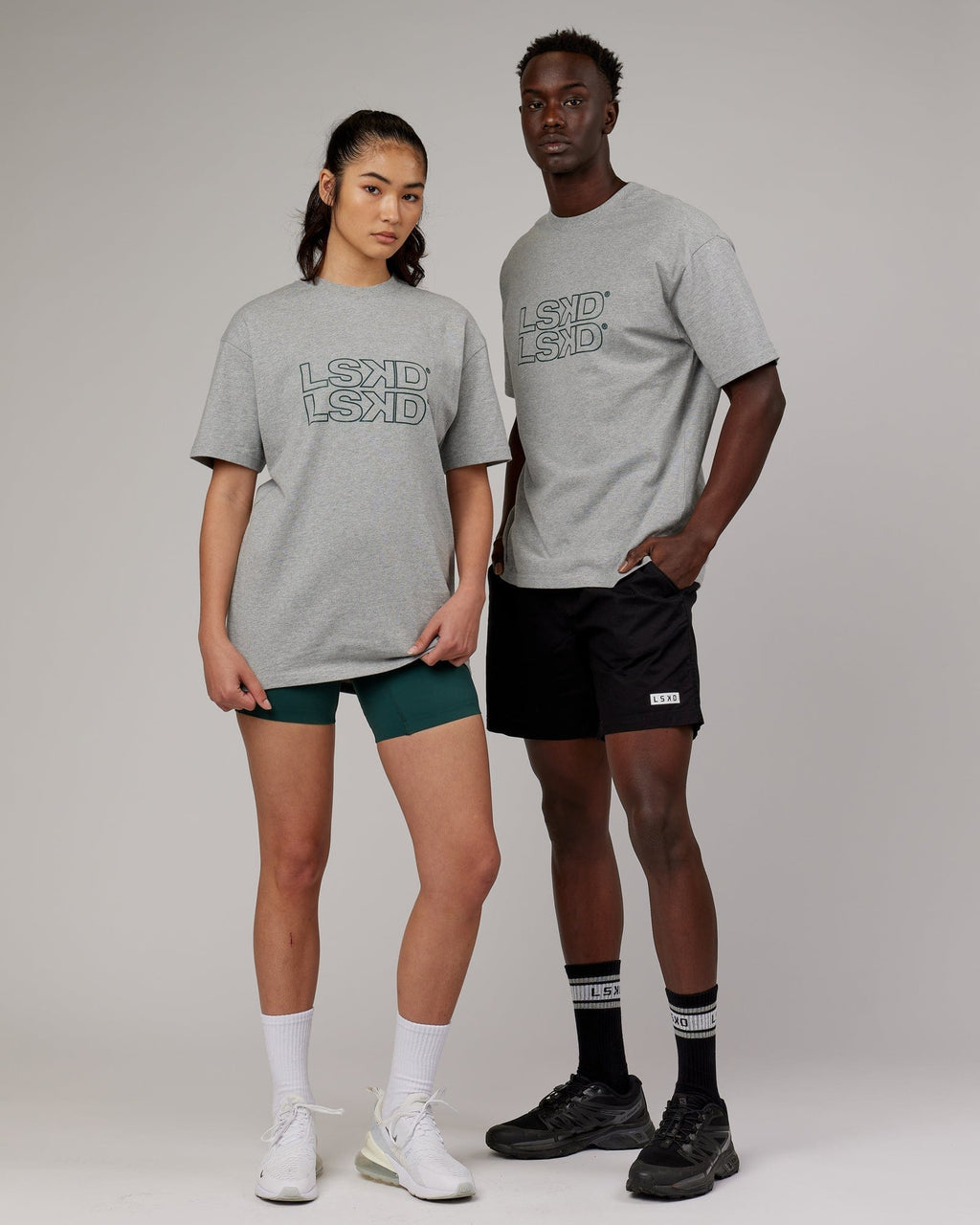 Model wearing Unisex Stacks Up Heavyweight Oversize Tee - Lt Grey Marl