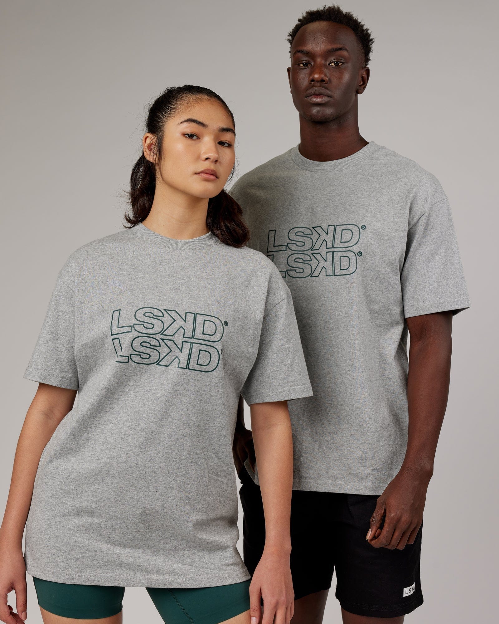 Model wearing Unisex Stacks Up Heavyweight Oversize Tee - Lt Grey Marl