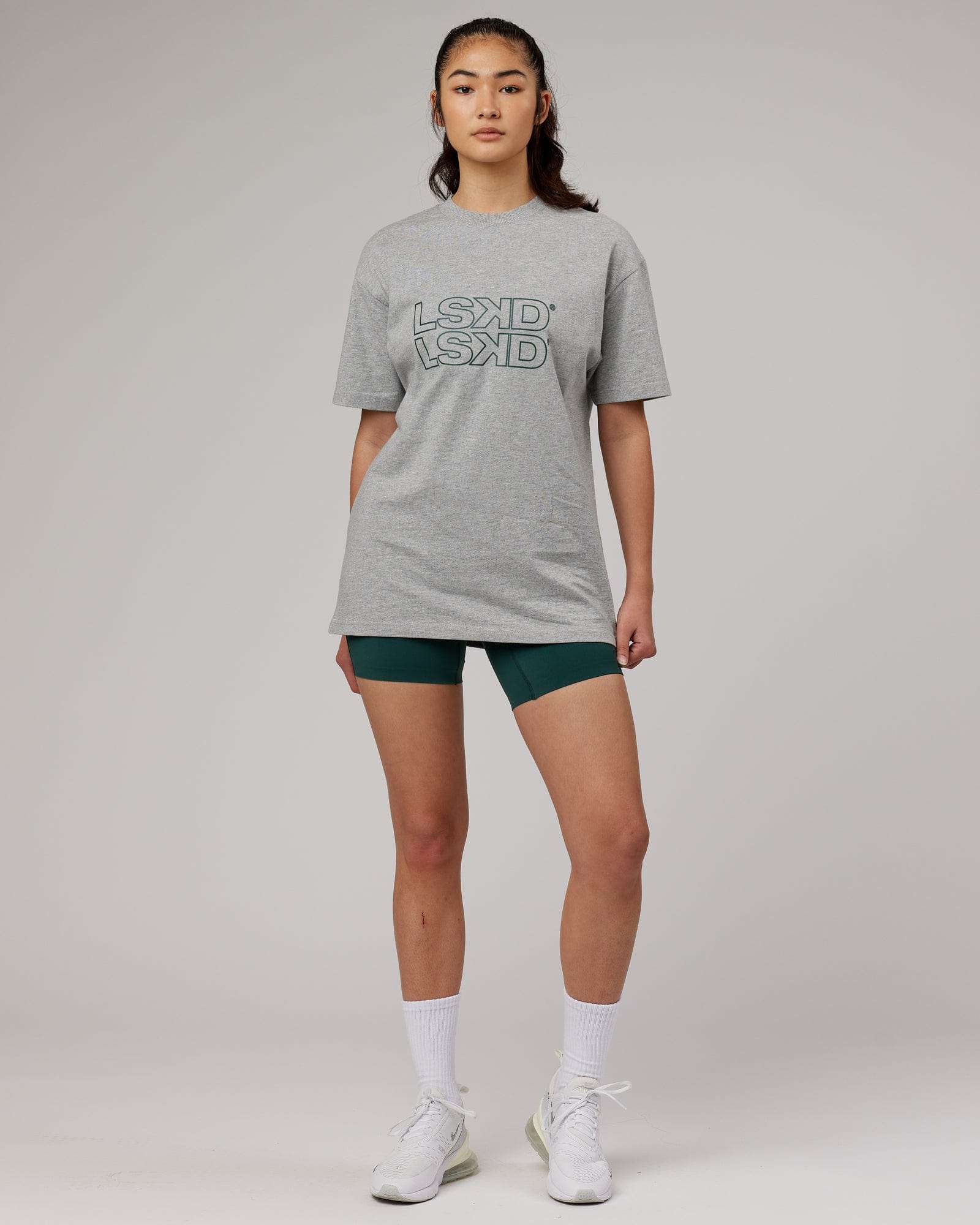 Model wearing Unisex Stacks Up Heavyweight Oversize Tee - Lt Grey Marl