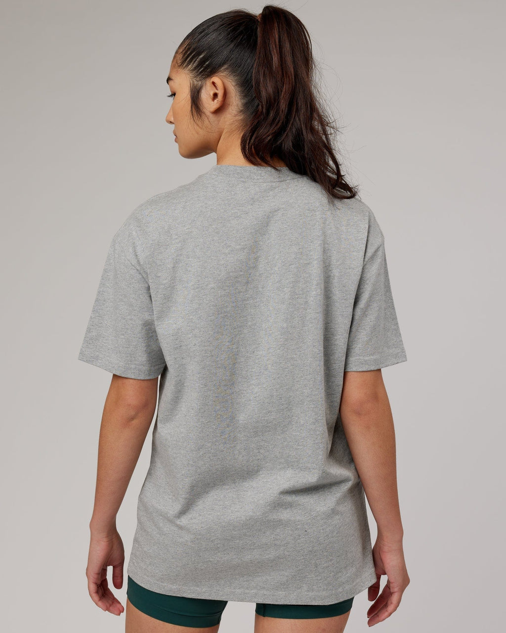 Model wearing Unisex Stacks Up Heavyweight Oversize Tee - Lt Grey Marl