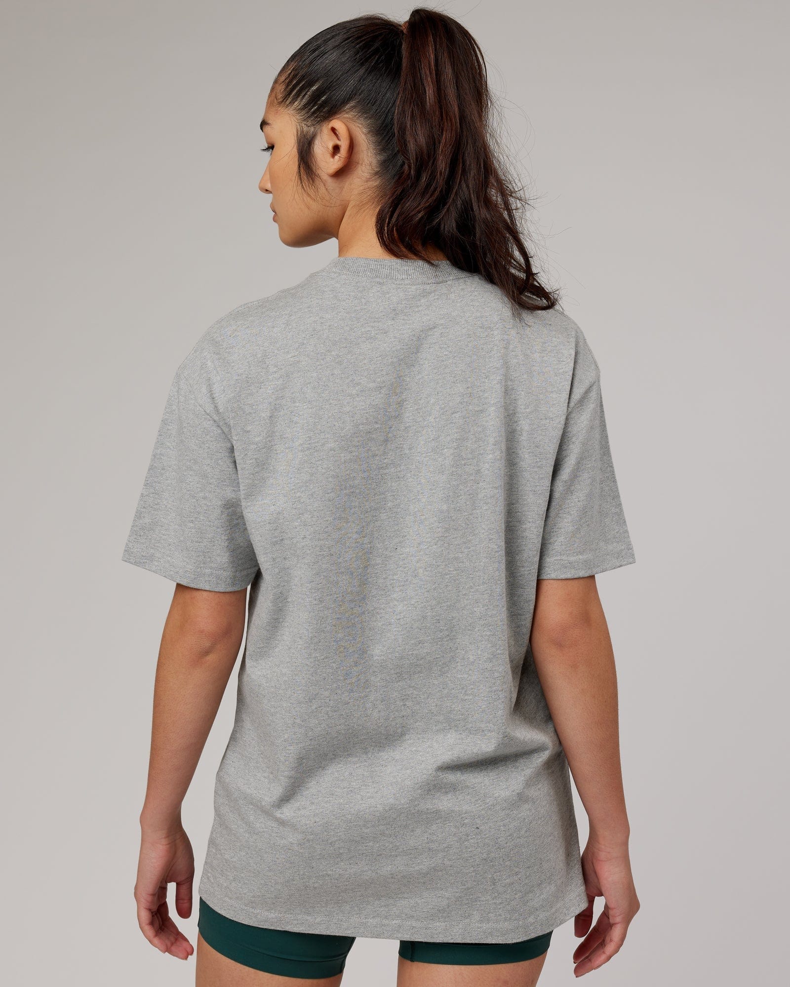 Model wearing Unisex Stacks Up Heavyweight Oversize Tee - Lt Grey Marl