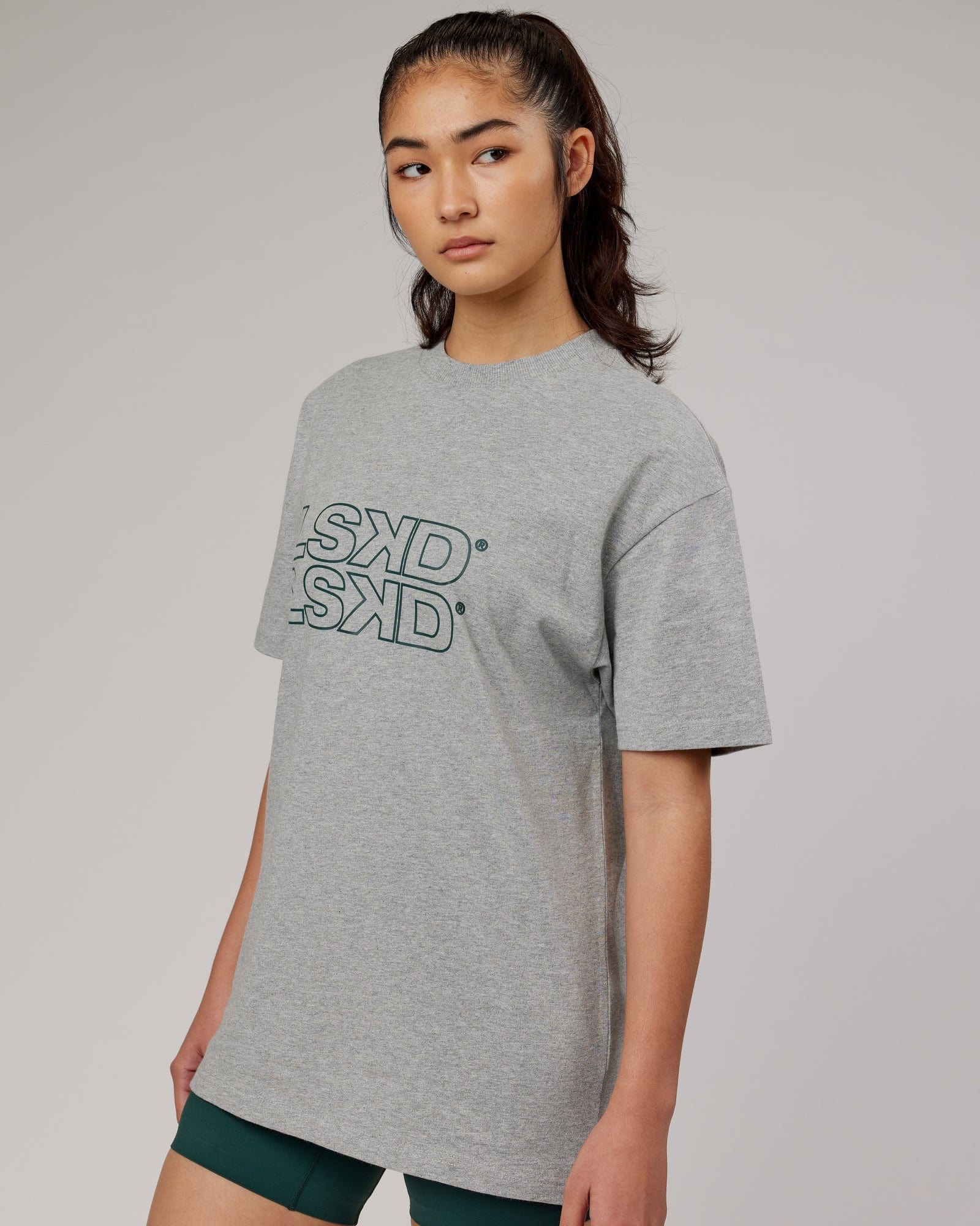 Model wearing Unisex Stacks Up Heavyweight Oversize Tee - Lt Grey Marl