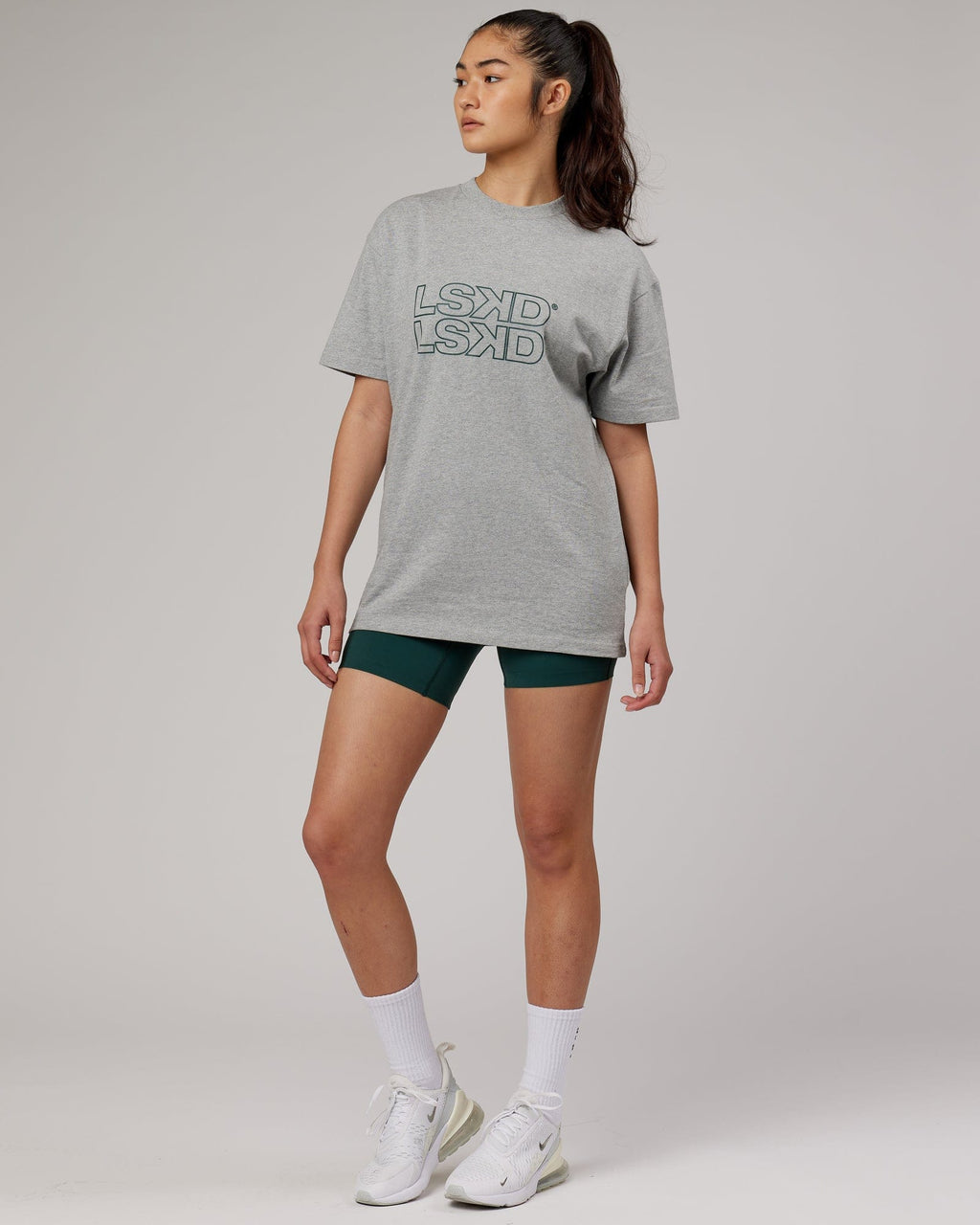 Model wearing Unisex Stacks Up Heavyweight Oversize Tee - Lt Grey Marl